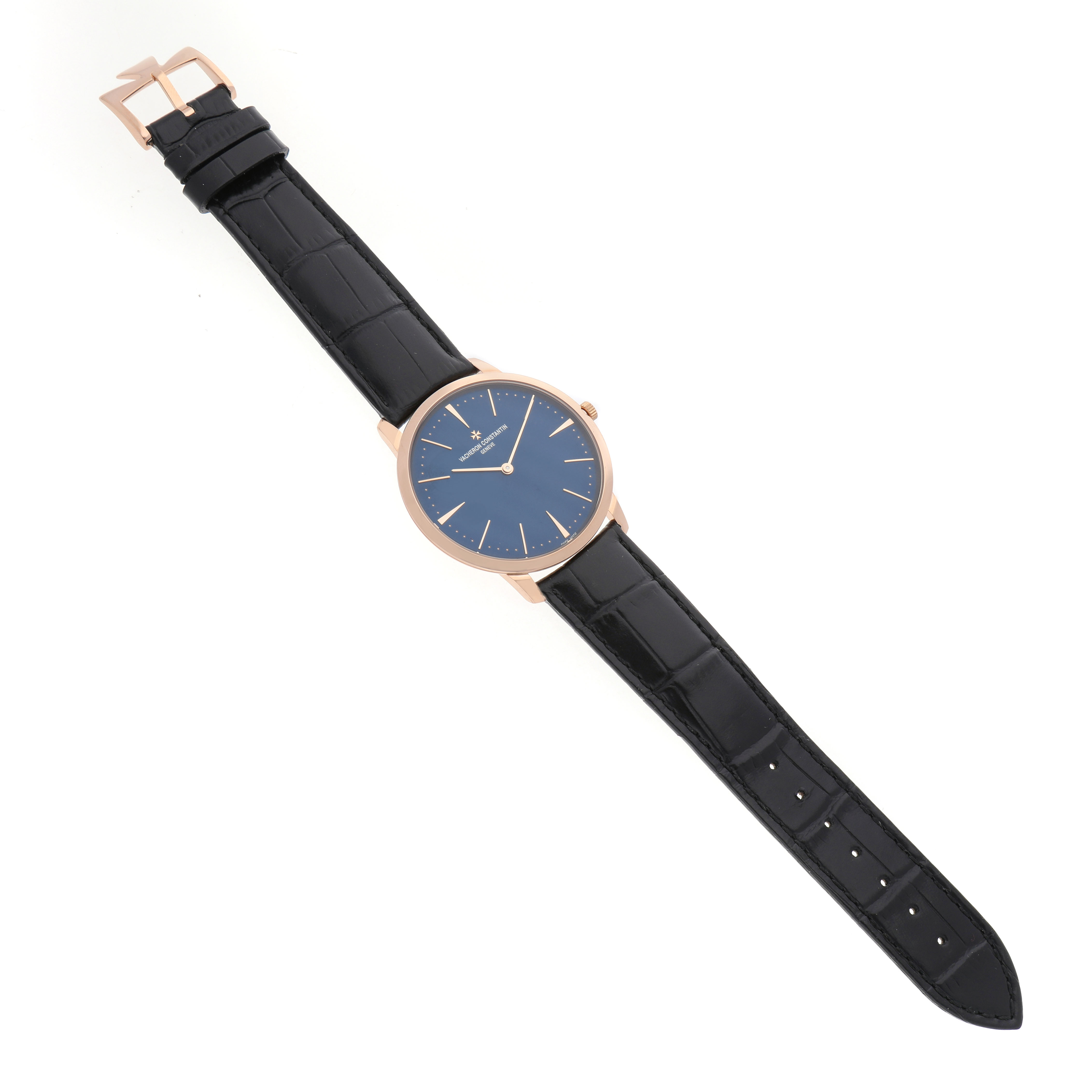 The Vacheron Constantin Patrimony 81180/000R-B518 Men's Rose Gold Blue Dial watch is shown at a top-down angle, highlighting its face, strap, and buckle.