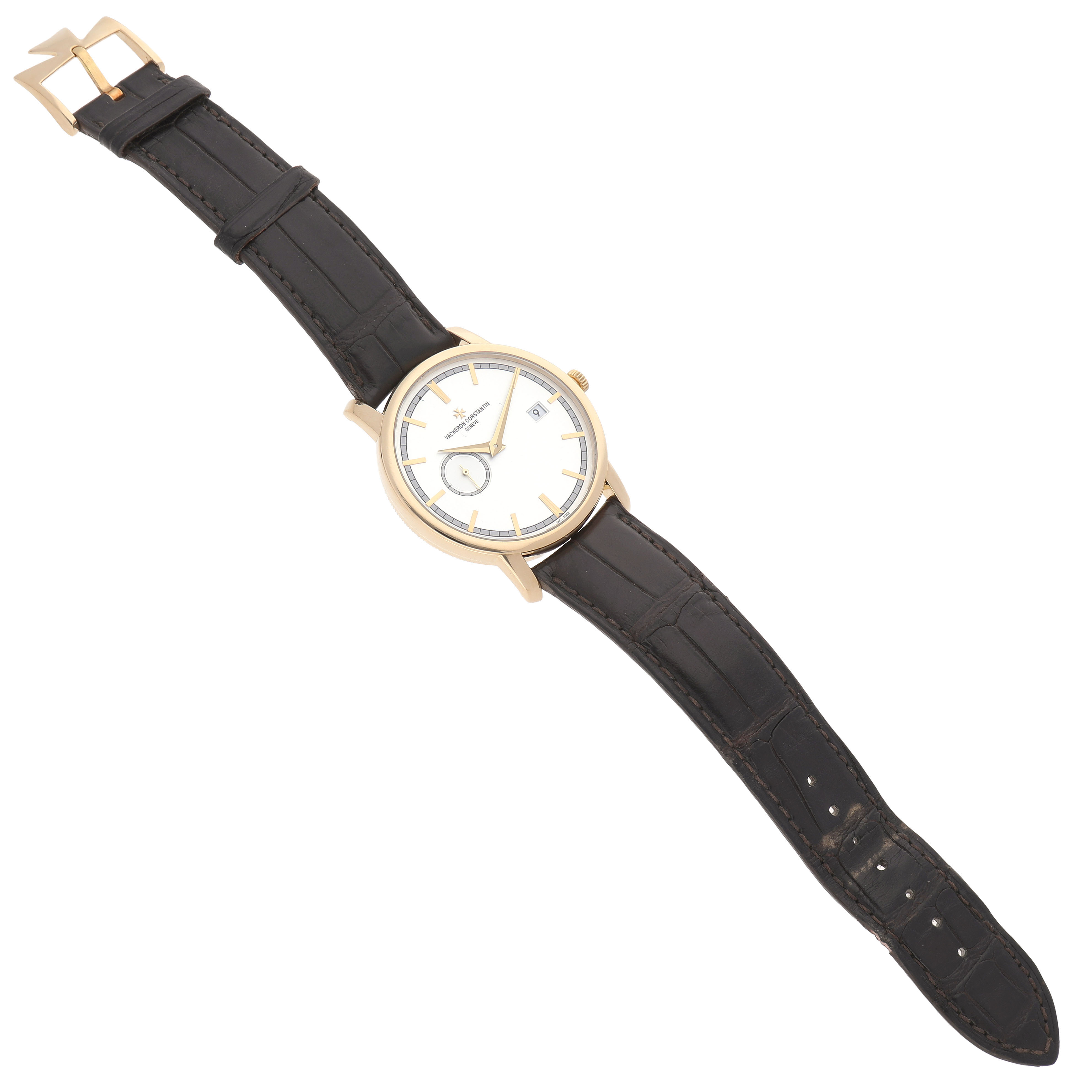 The Vacheron Constantin Traditionnelle 87172/000J-9512 Men's Yellow Gold Silver Dial watch is shown from an angled top view displaying the face, strap, buckle, and crown.