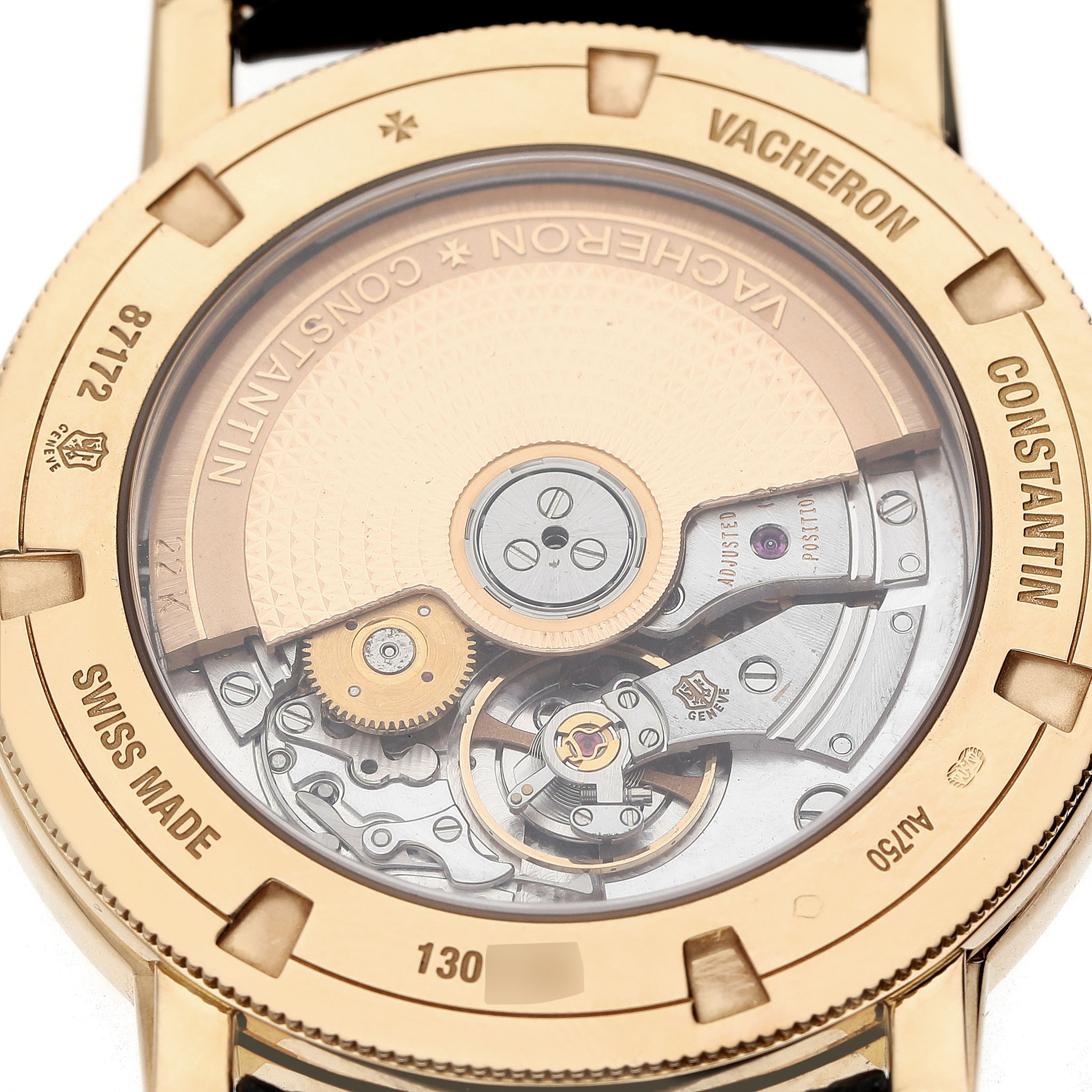 The image shows the back view of a Vacheron Constantin Traditionnelle 87172/000J-9512 Men's Yellow Gold Silver Dial, highlighting its intricate movement and rotor.