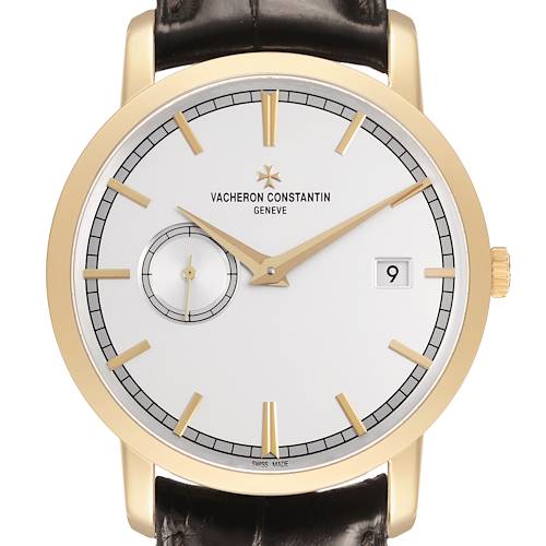 The Traditionnelle model by Vacheron Constantin is shown from a front angle, highlighting the dial, hands, date window, and indices.