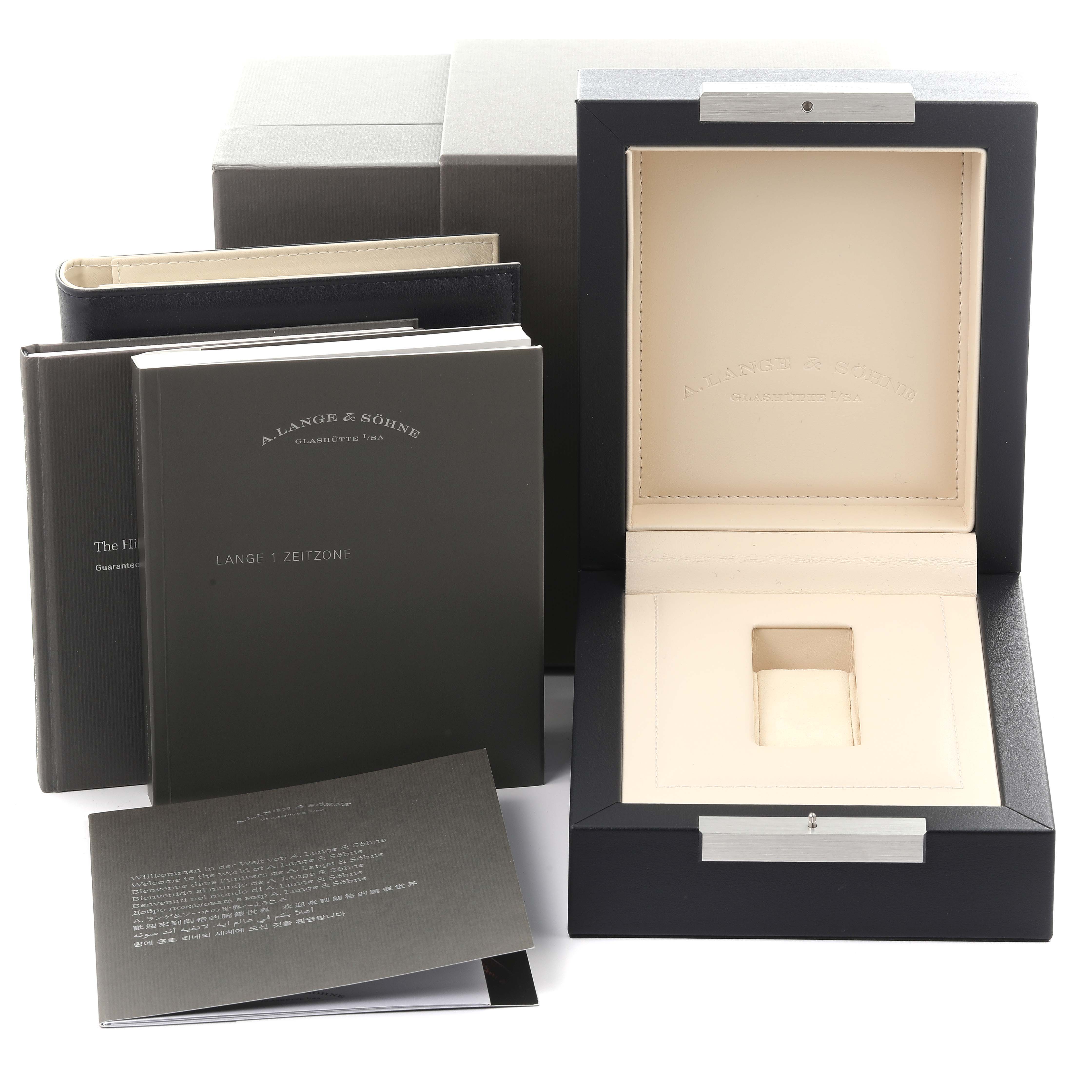 The image shows the packaging, manuals, and empty display box for an A. Lange 
Sohne Lange 1 116.025 Men
s Platinum Silver Dial watch.