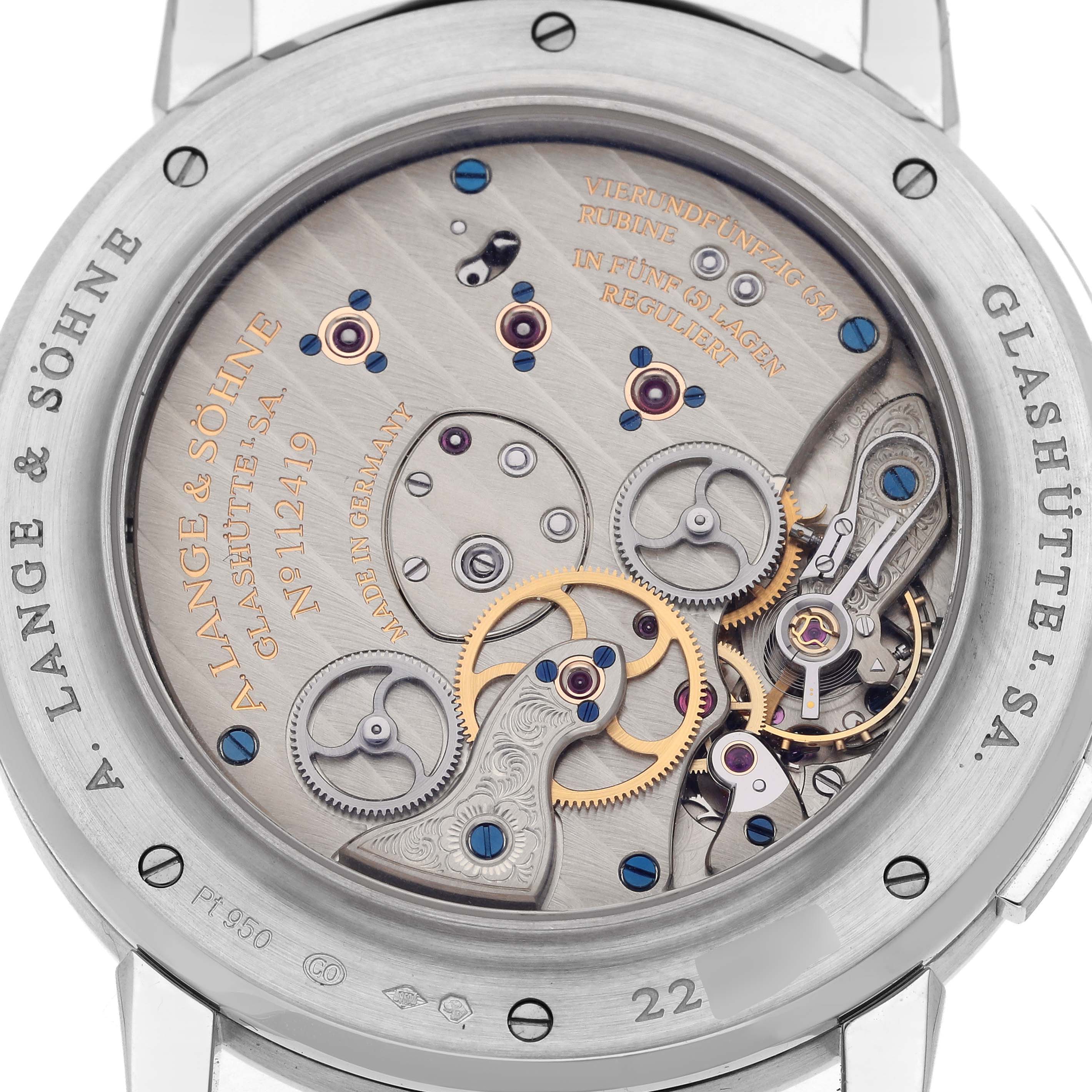 The image shows the back of the A. Lange 
Sohne Lange 1 116.025 Men
s Platinum Silver Dial, featuring intricate mechanical components and engravings.