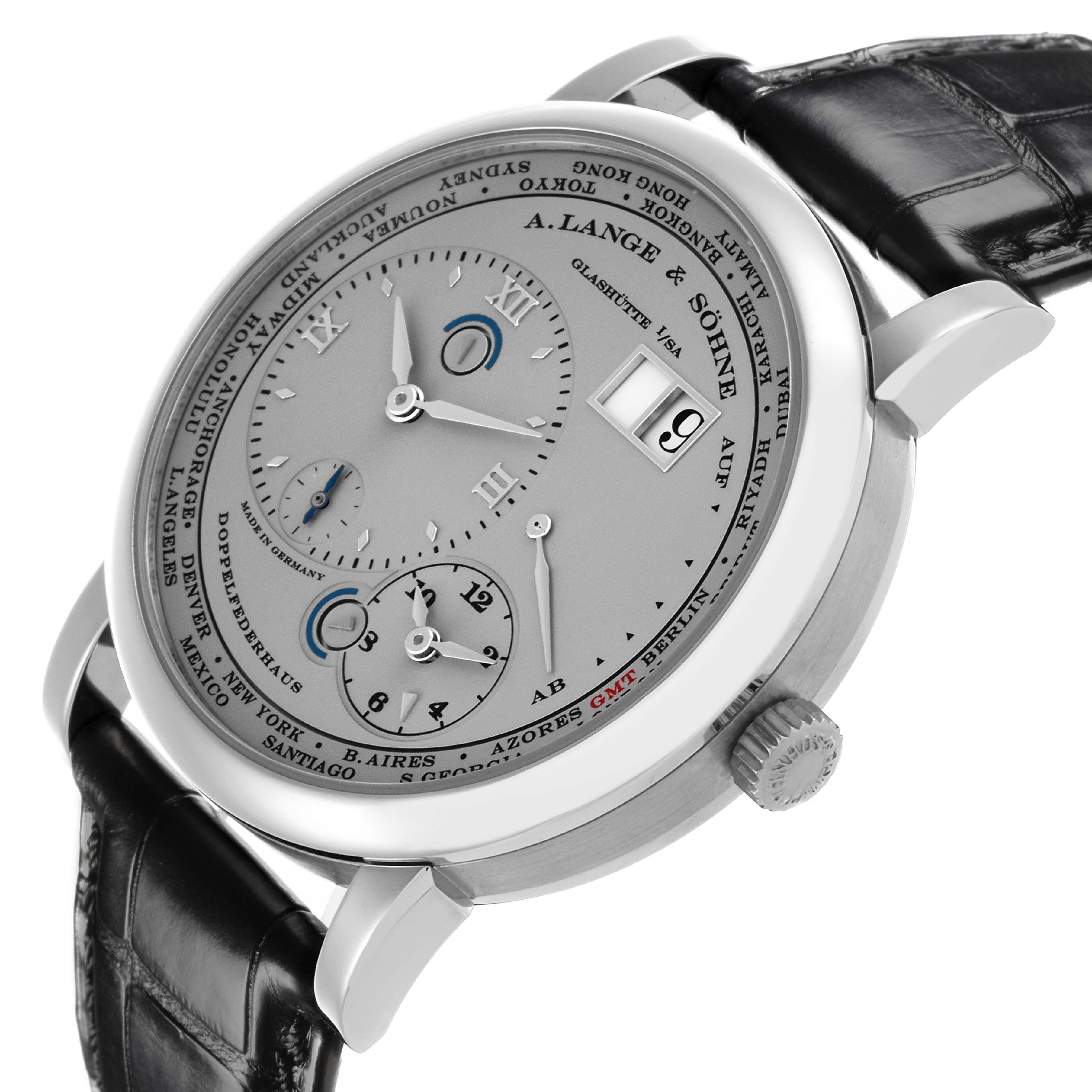 The A. Lange 
Sohne Lange 1 116.025 Men
s Platinum Silver Dial watch is shown at an angled side view, displaying its dial, crown, and black strap.