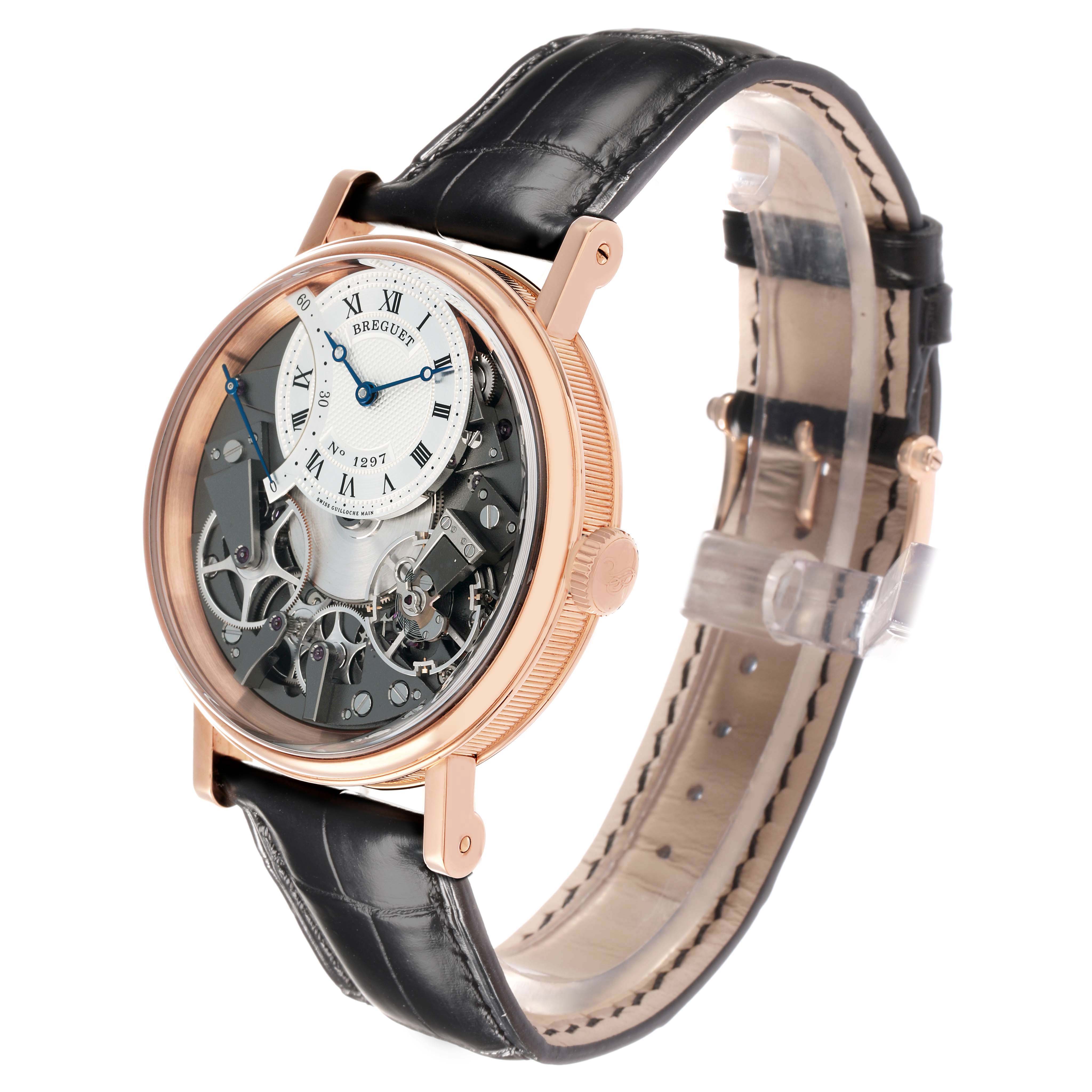 The Breguet Tradition 7097BR/G1/9WU Men
s Rose Gold Transparent Dial watch is shown at an angle displaying its dial, crown, and leather strap.