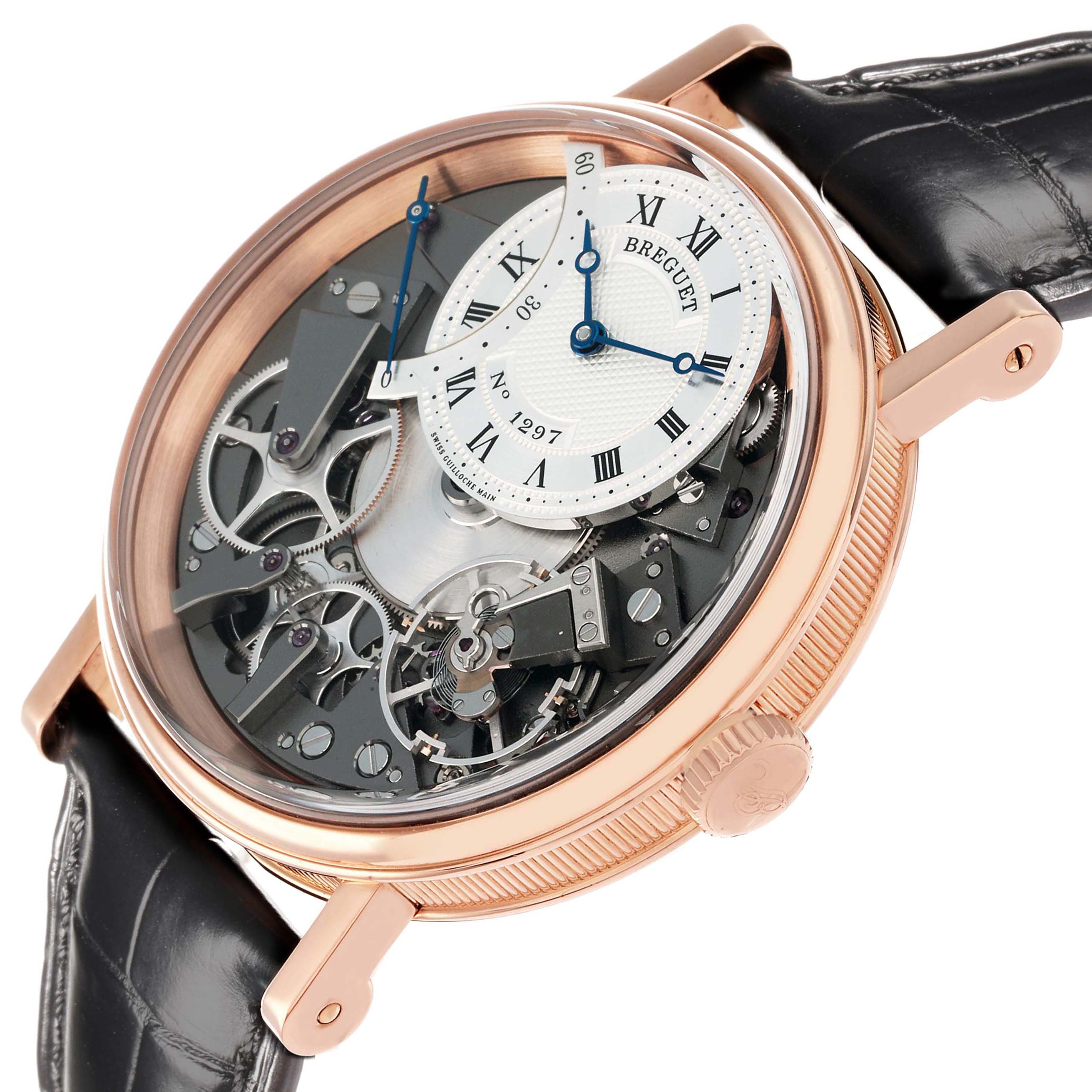 The Breguet Tradition 7097BR/G1/9WU Men
s Rose Gold Transparent Dial watch is shown at a slight angle, revealing its intricate exposed movement and off-center dial.
