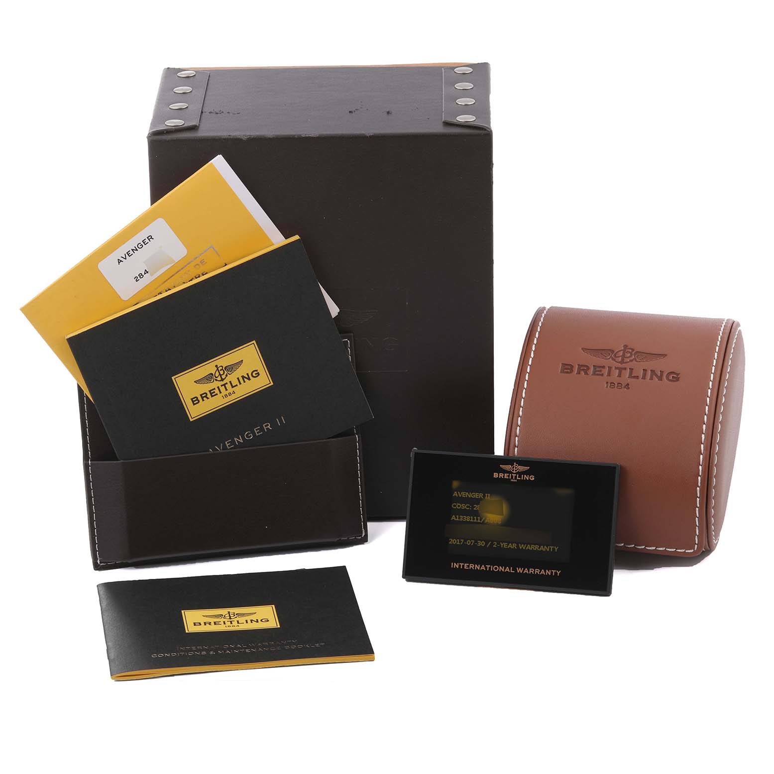 The image shows Breitling Avenger A1338111/A868 Men's Stainless Steel Mother of Pearl Dial A1338111/A868 Men's Stainless Steel Mother of Pearl Dial accessories including manuals, warranty card, box, and leather case from a front angle.