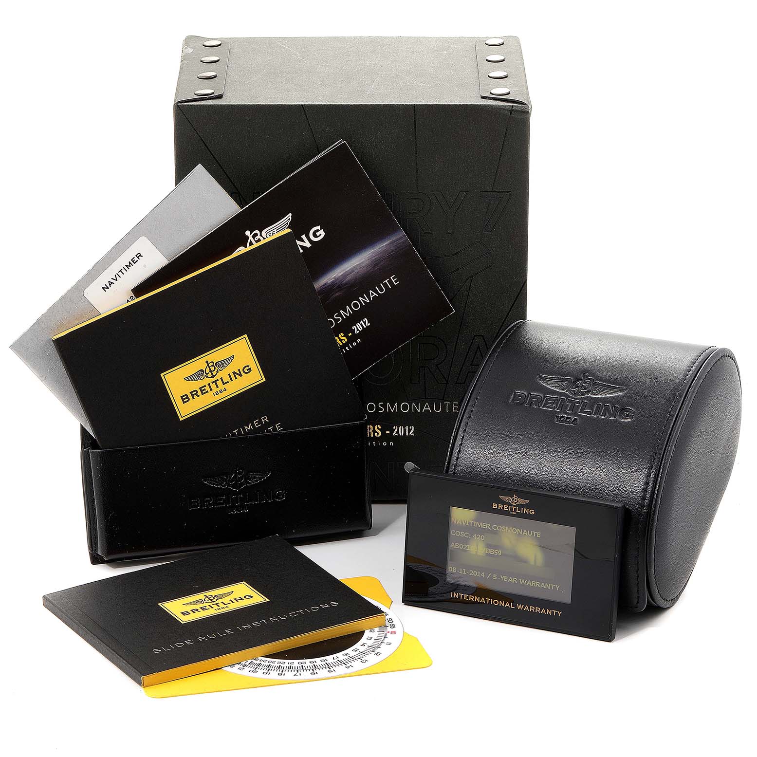 The image shows accessories for a Breitling Navitimer AB0210 Men
s Stainless Steel Black Dial AB0210 Men
s Stainless Steel Black Dial watch, including manuals, a warranty card, and a leather case.