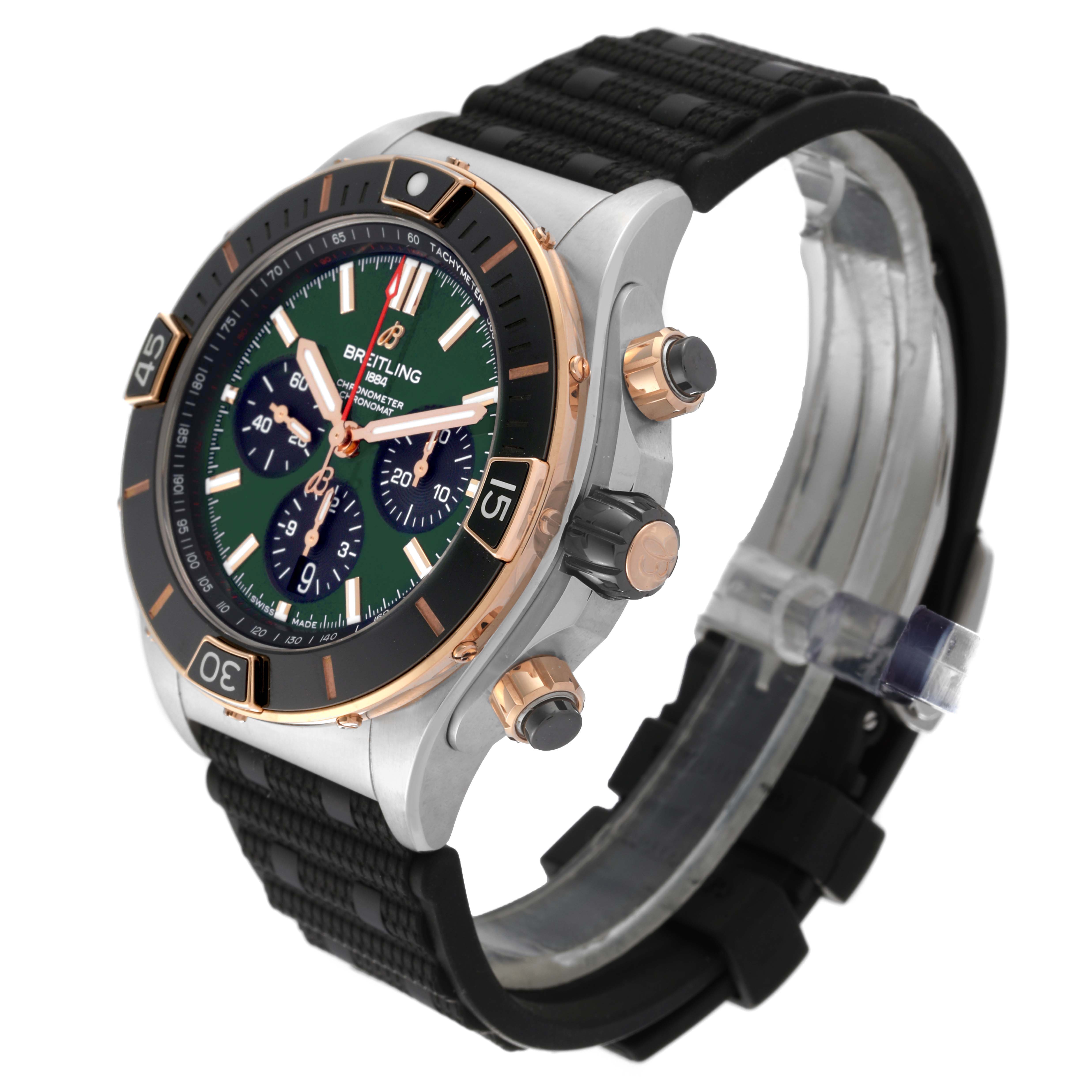 The image shows a Breitling Chronomat UB0136 Men's Stainless Steel Green Dial UB0136 Men's Stainless Steel Green Dial watch at a 3/4 angle, displaying its bezel, crown, pushers, and rubber strap.