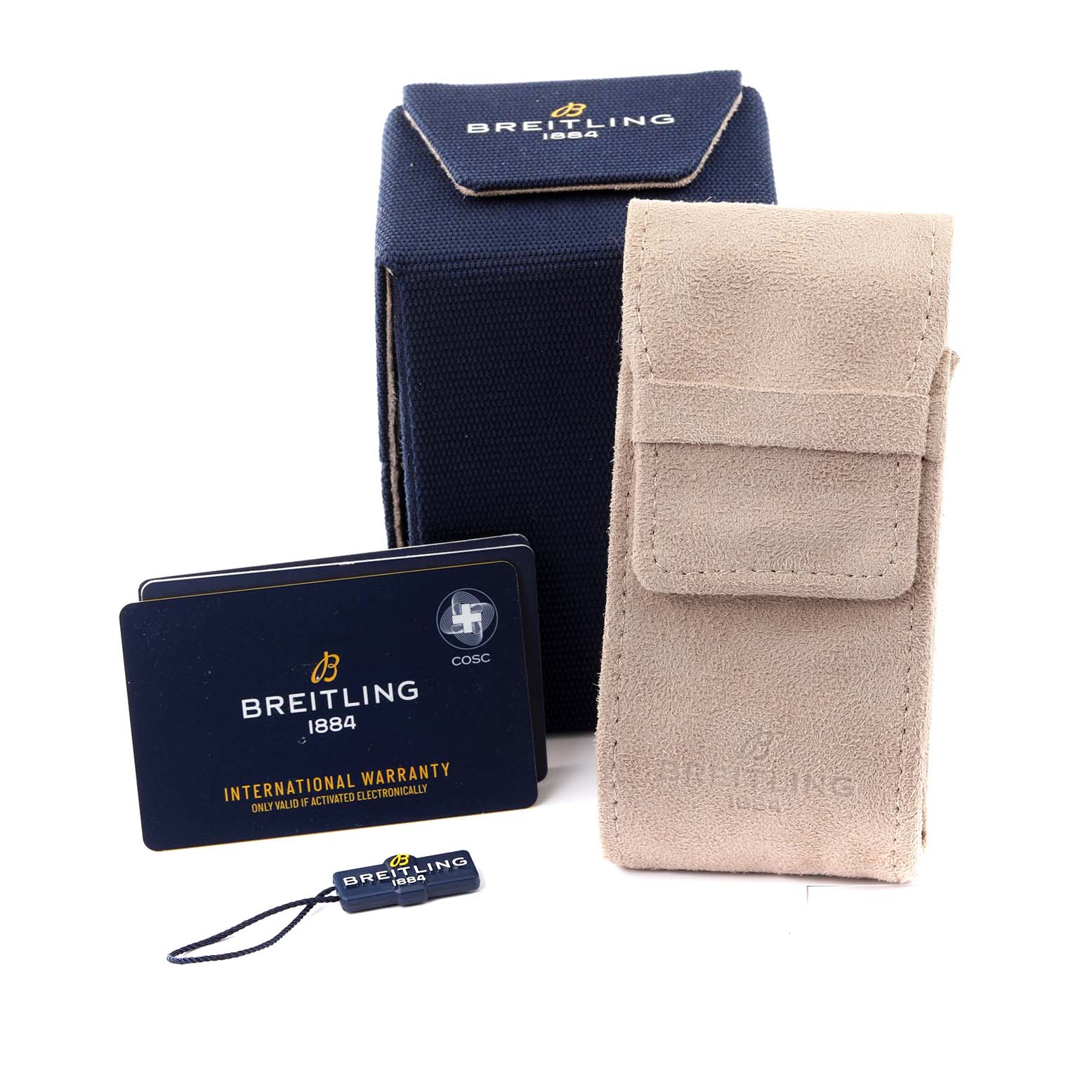 The image shows accessories for a Breitling Superocean A17376 Men's Stainless Steel Blue Dial A17376 Men's Stainless Steel Blue Dial model, including a blue box, beige pouch, warranty cards, and a small tag.
