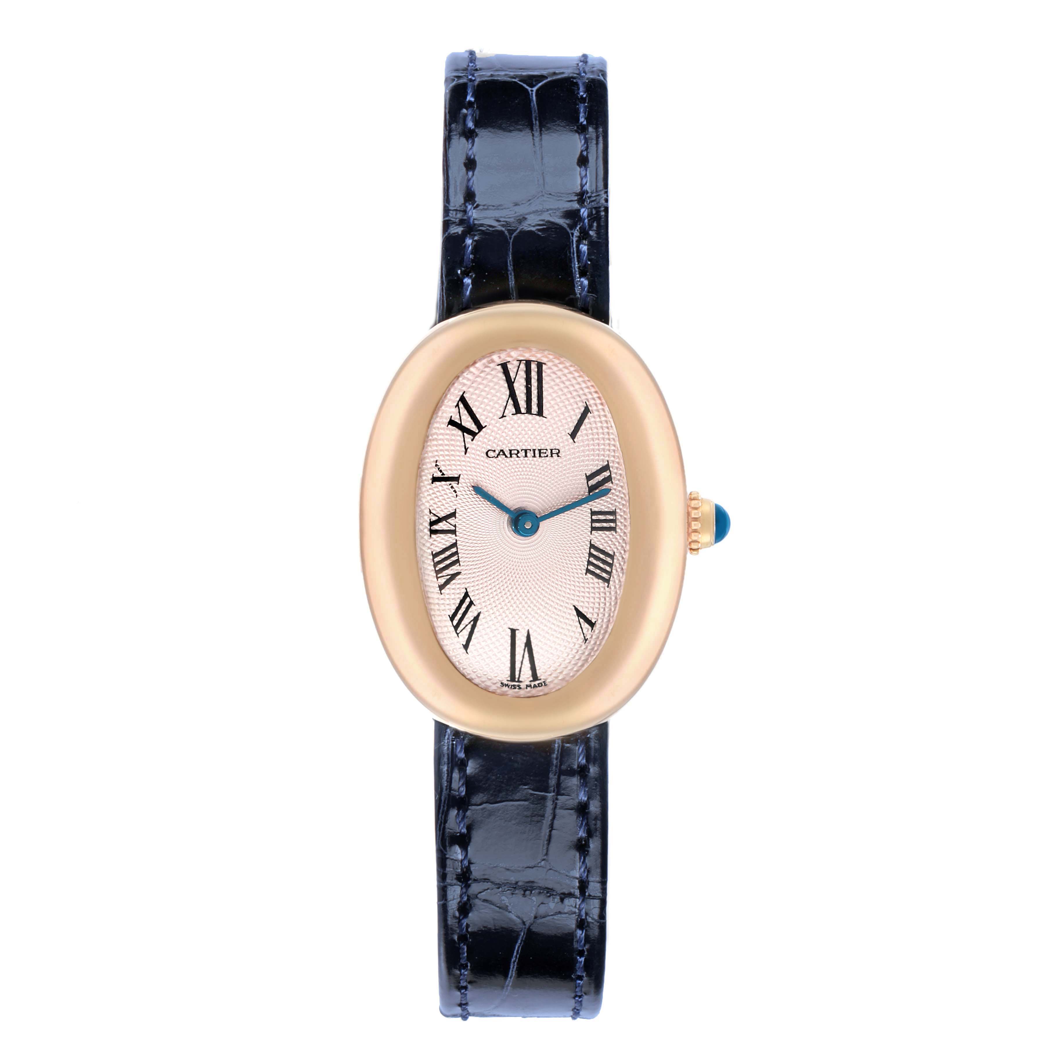 The image shows a Cartier Baignoire W1544956 Women
s Rose Gold Pink Dial watch from a top-down angle, highlighting the oval face, roman numerals, and blue strap.