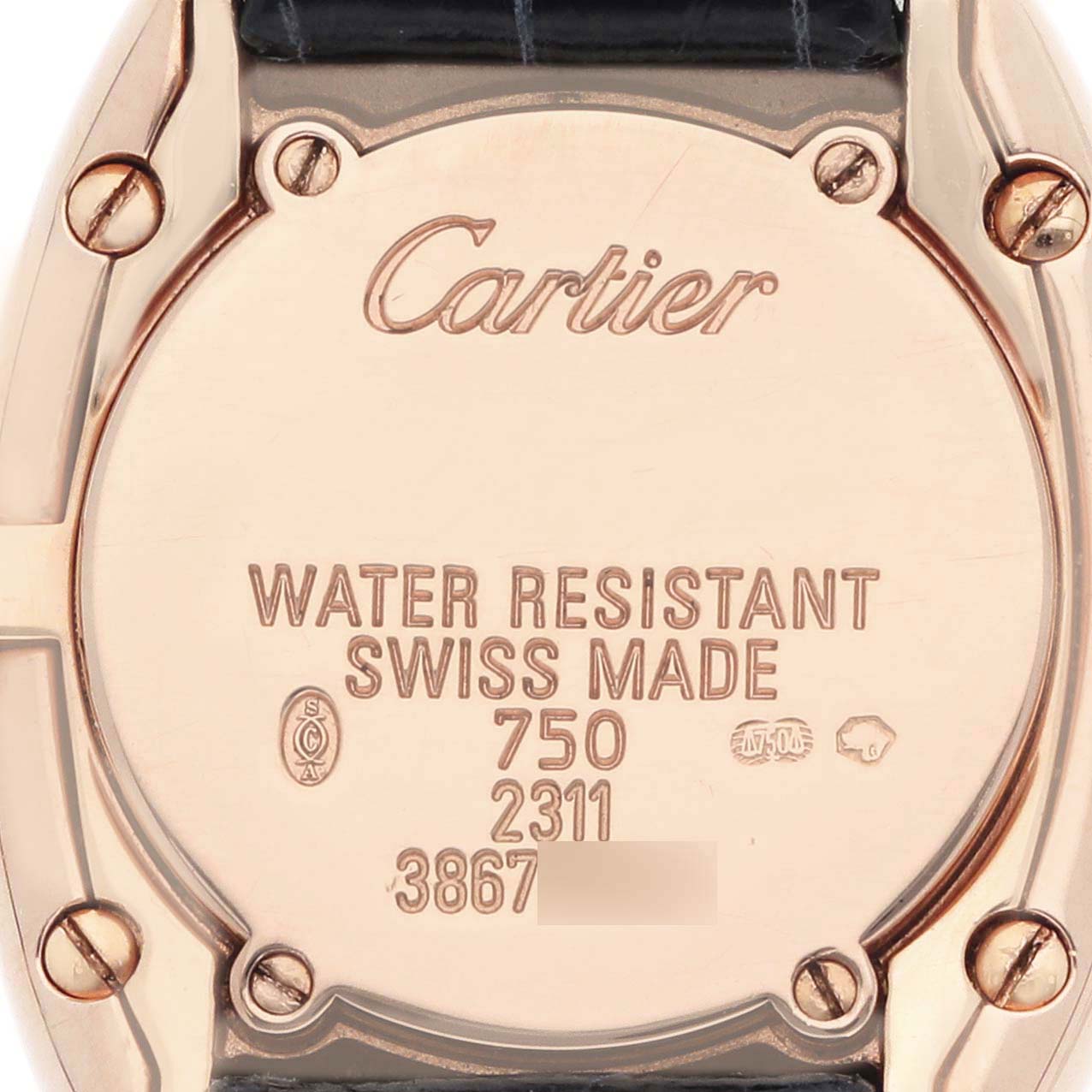 The image shows the back of a Cartier Baignoire W1544956 Women
s Rose Gold Pink Dial watch featuring engraved details and screws.