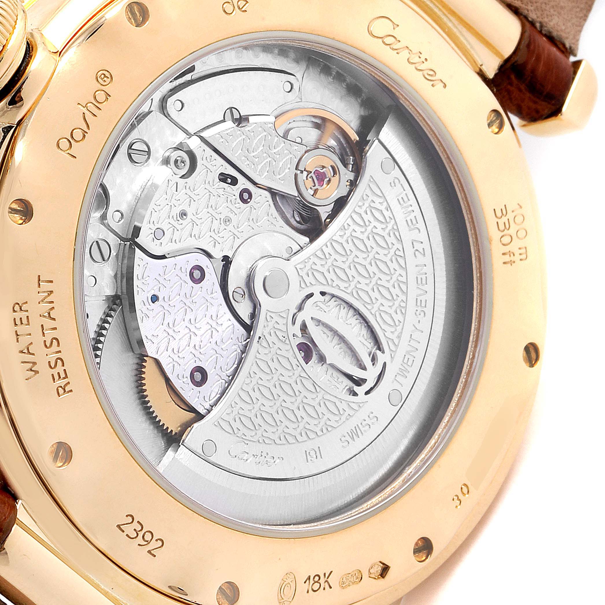 This image shows the back view of a Cartier Pasha W3004856 Men's Yellow Gold Silver Dial W3004856 Men's Yellow Gold Silver Dial watch, highlighting its automatic movement and engravings.