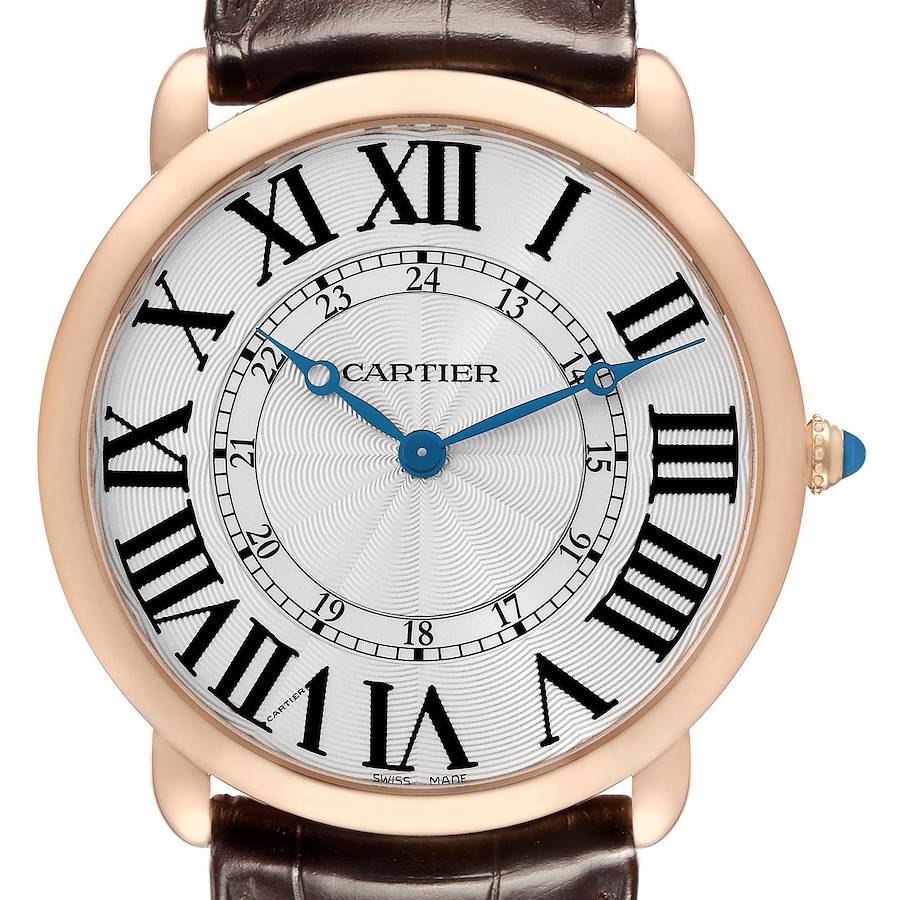 The Cartier Ronde W6801004 Men's Rose Gold Silver Dial watch is shown from a front angle, displaying the dial, Roman numerals, blue hands, and a leather strap.