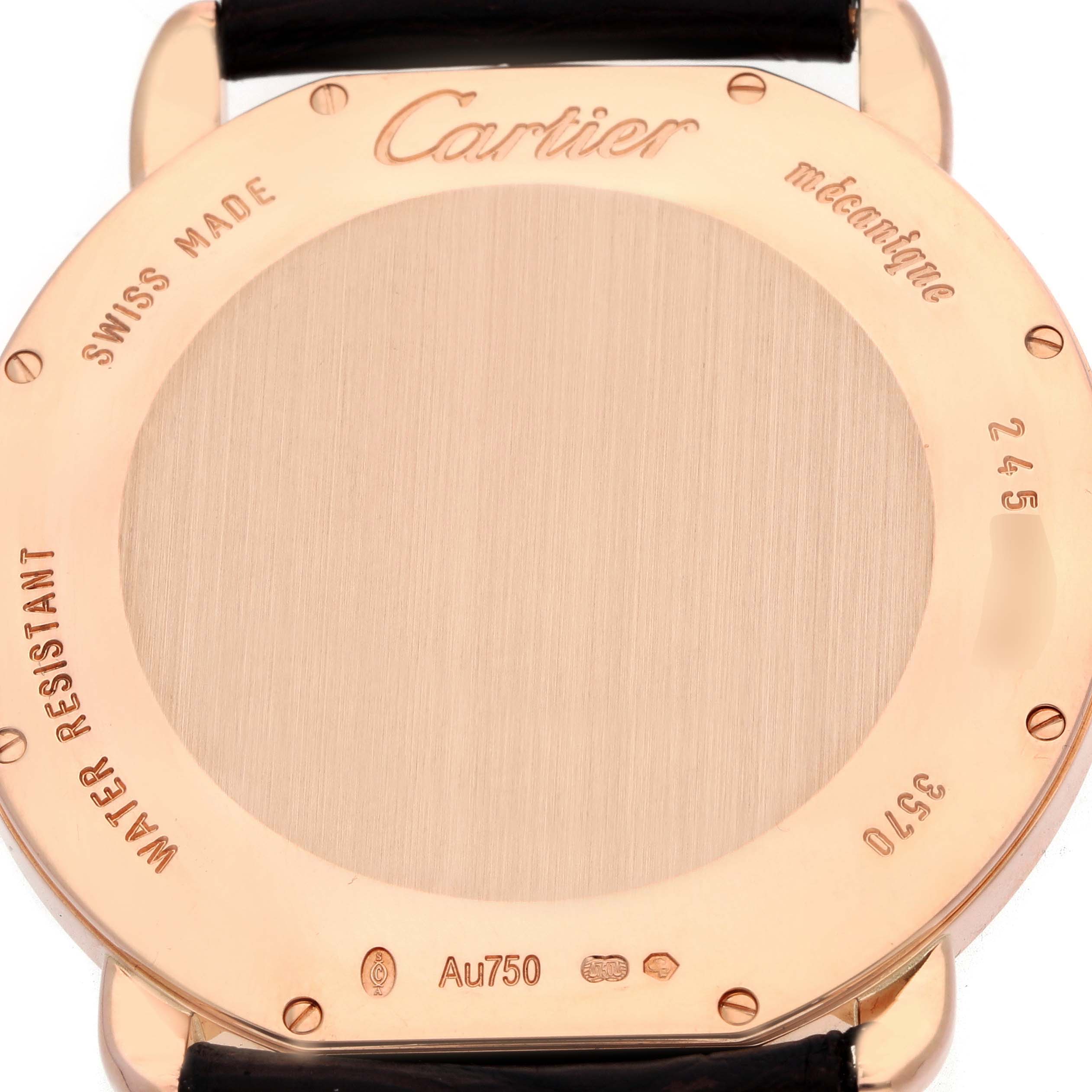 The image shows the back case of a Cartier Ronde W6801004 Men
s Rose Gold Silver Dial watch, highlighting engravings and a leather strap attachment.