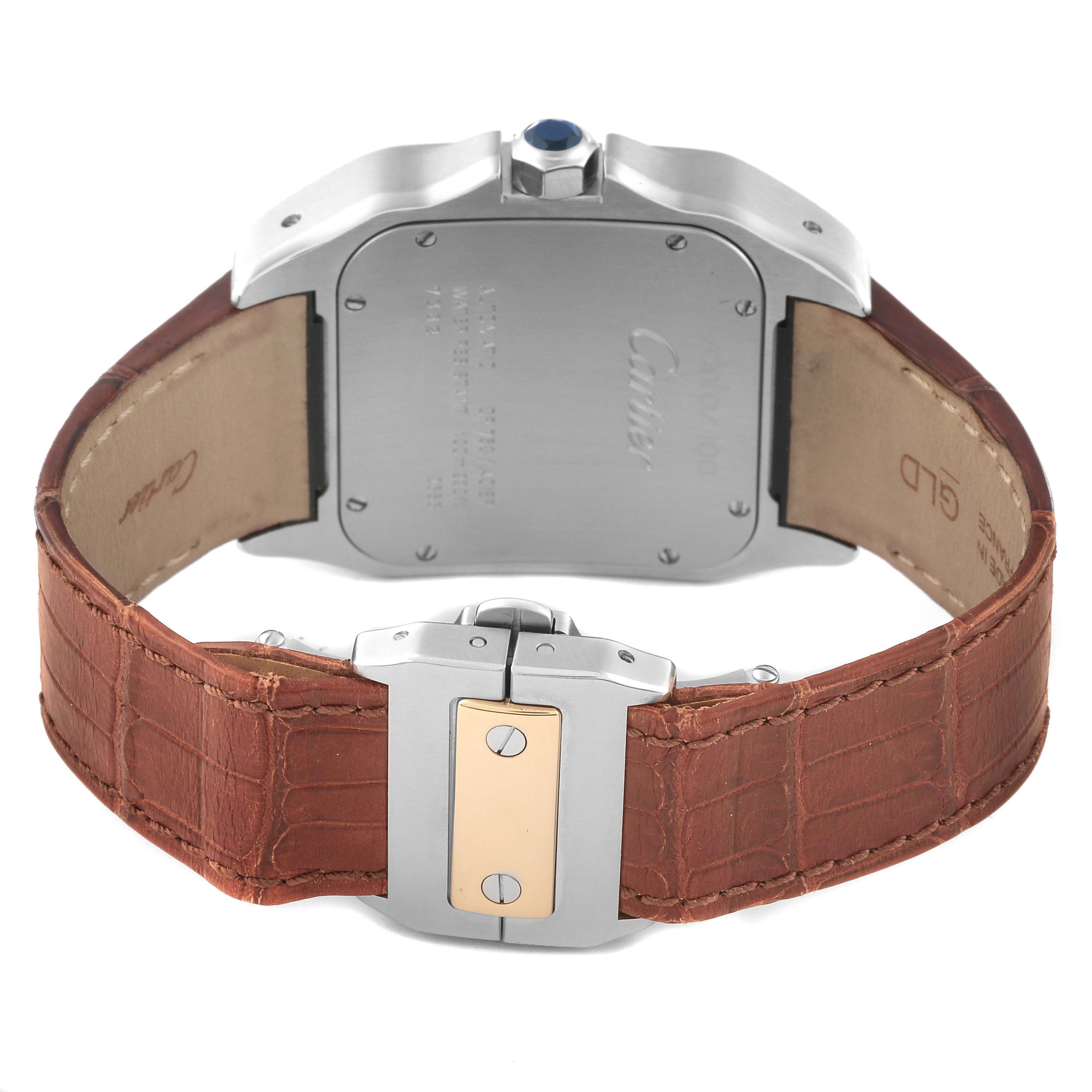 This image shows the back of the Cartier Santos W20072X7 Men
s Steel and Gold (two tone) Silver Dial W20072X7 Men
s Steel and Gold (two tone) Silver Dial watch and its brown leather strap with a close-up of the clasp.