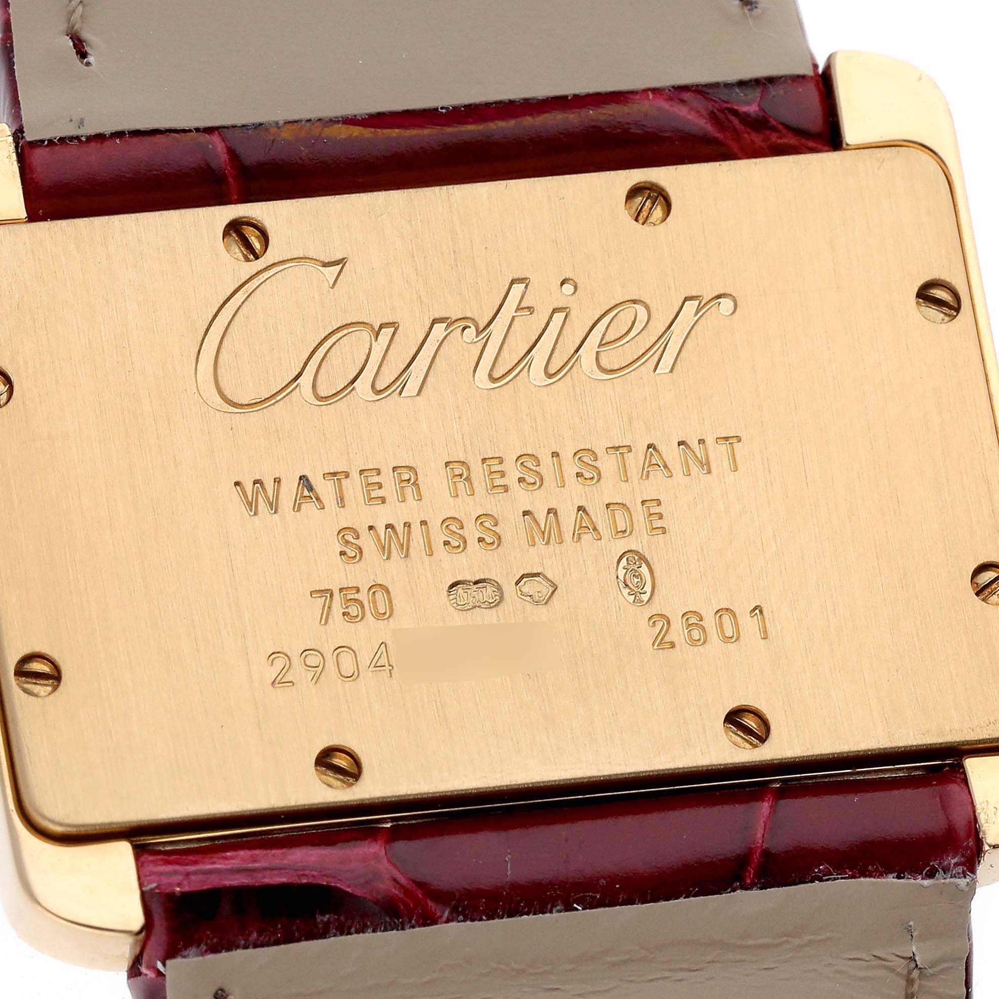 The image shows the back of a Cartier Tank Divan W6300356 Women's Yellow Gold Silver Dial W6300356 Women's Yellow Gold Silver Dial watch, displaying engraving details and part of the leather strap.