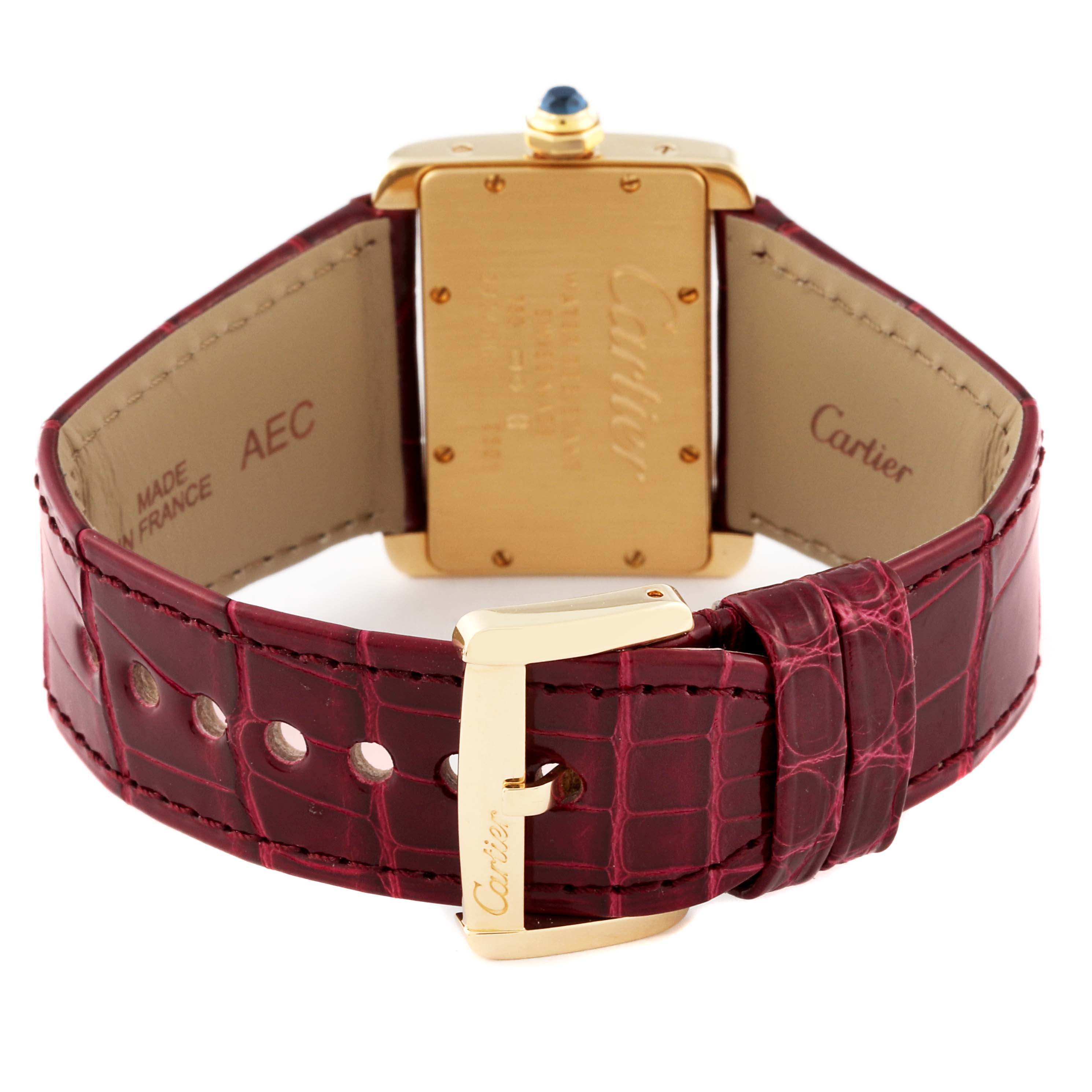 The Cartier Tank Divan W6300356 Women's Yellow Gold Silver Dial W6300356 Women's Yellow Gold Silver Dial watch is shown from the back, highlighting the case, leather strap, and buckle.