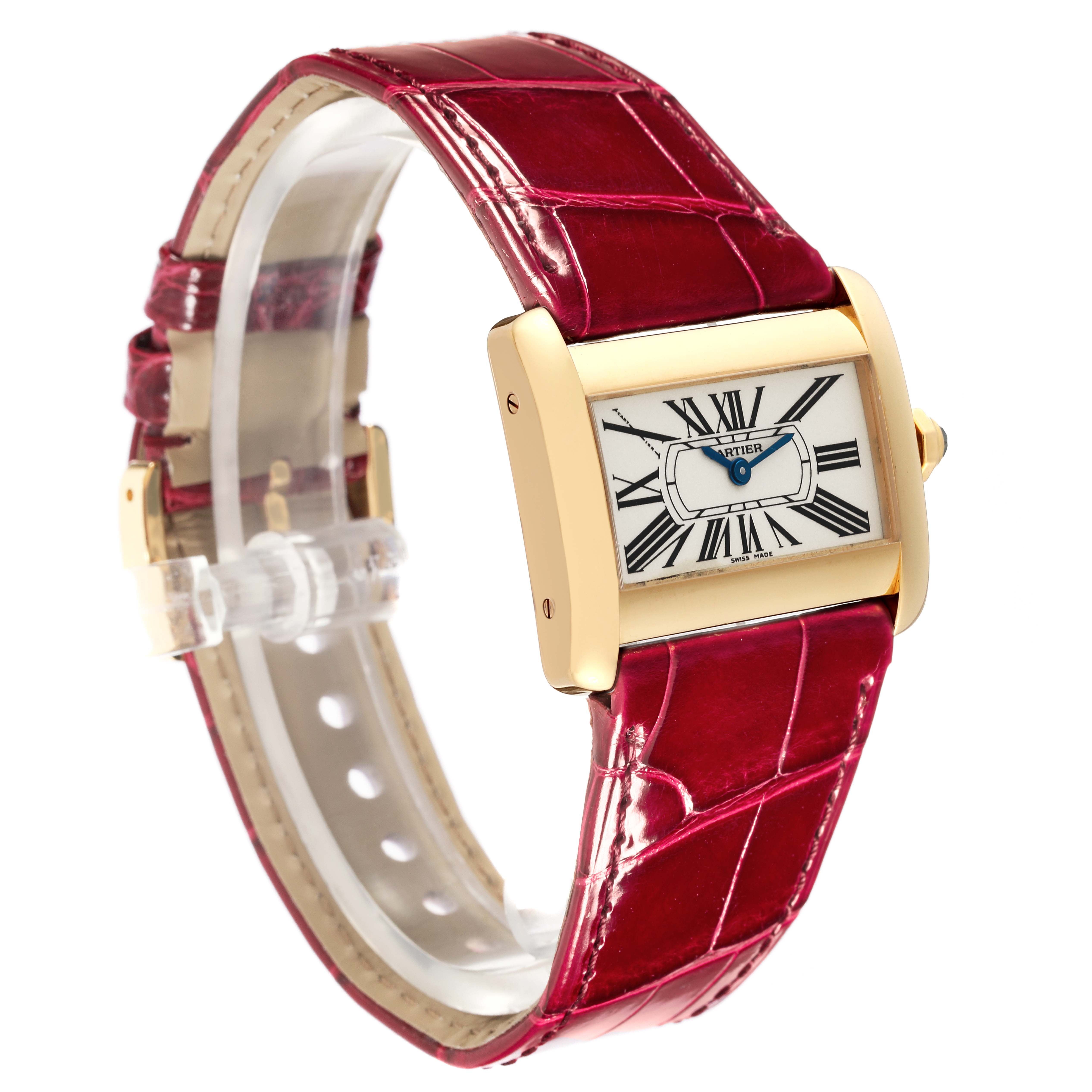 The Cartier Tank Divan W6300356 Women's Yellow Gold Silver Dial W6300356 Women's Yellow Gold Silver Dial watch is shown at a slight angle, highlighting the gold case, roman numeral dial, and red leather strap.