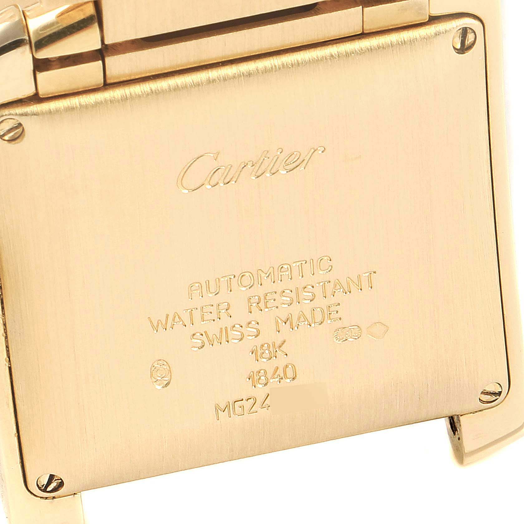 The image shows a close-up of the back case of a Cartier Tank Francaise W50001R2 Men's Yellow Gold Silver Dial W50001R2 Men's Yellow Gold Silver Dial watch, displaying its specifications and engravings.