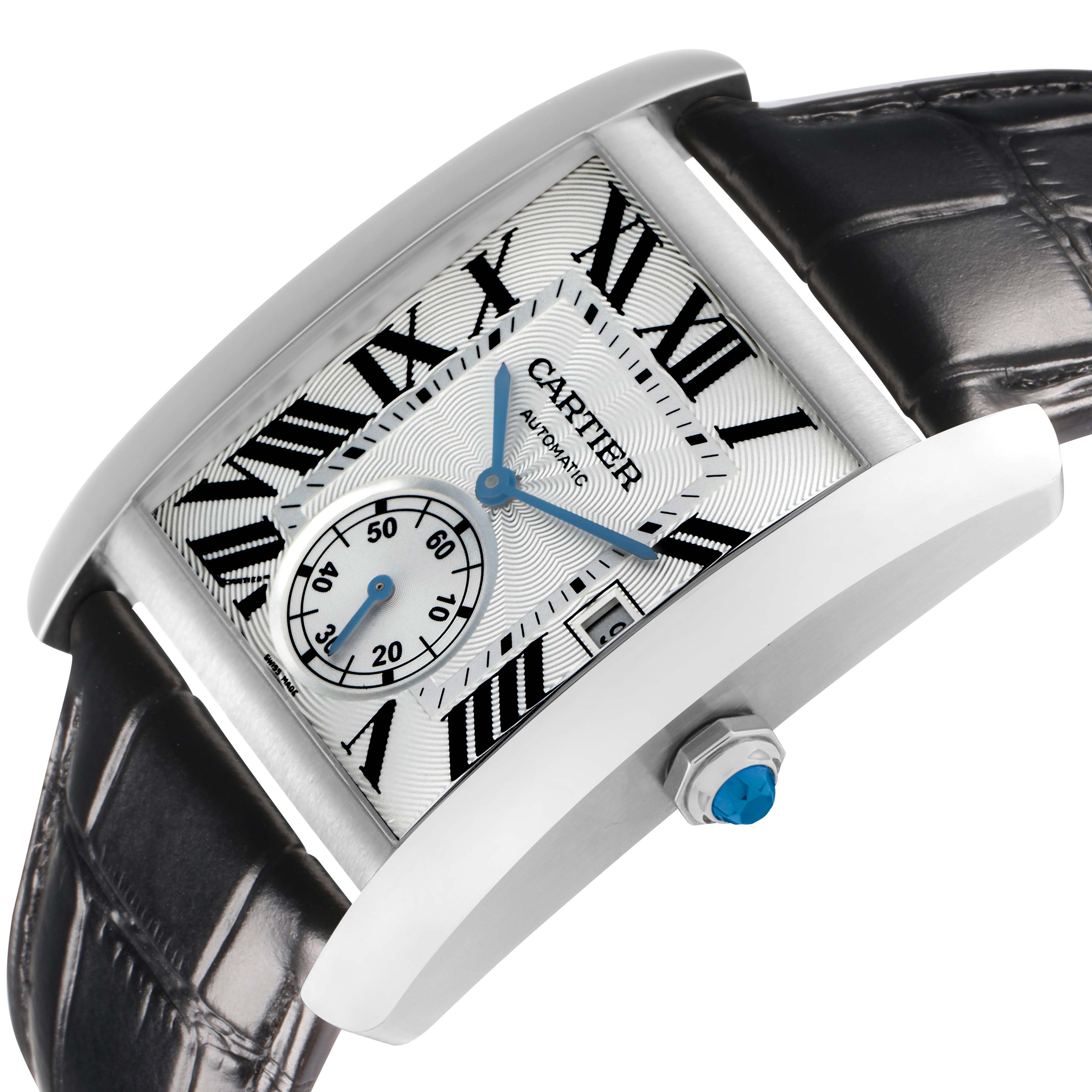 The Cartier Tank MC W5330003 Men
s Stainless Steel Silver Dial watch is shown at a tilted angle, highlighting the rectangular face, Roman numerals, and black leather strap.