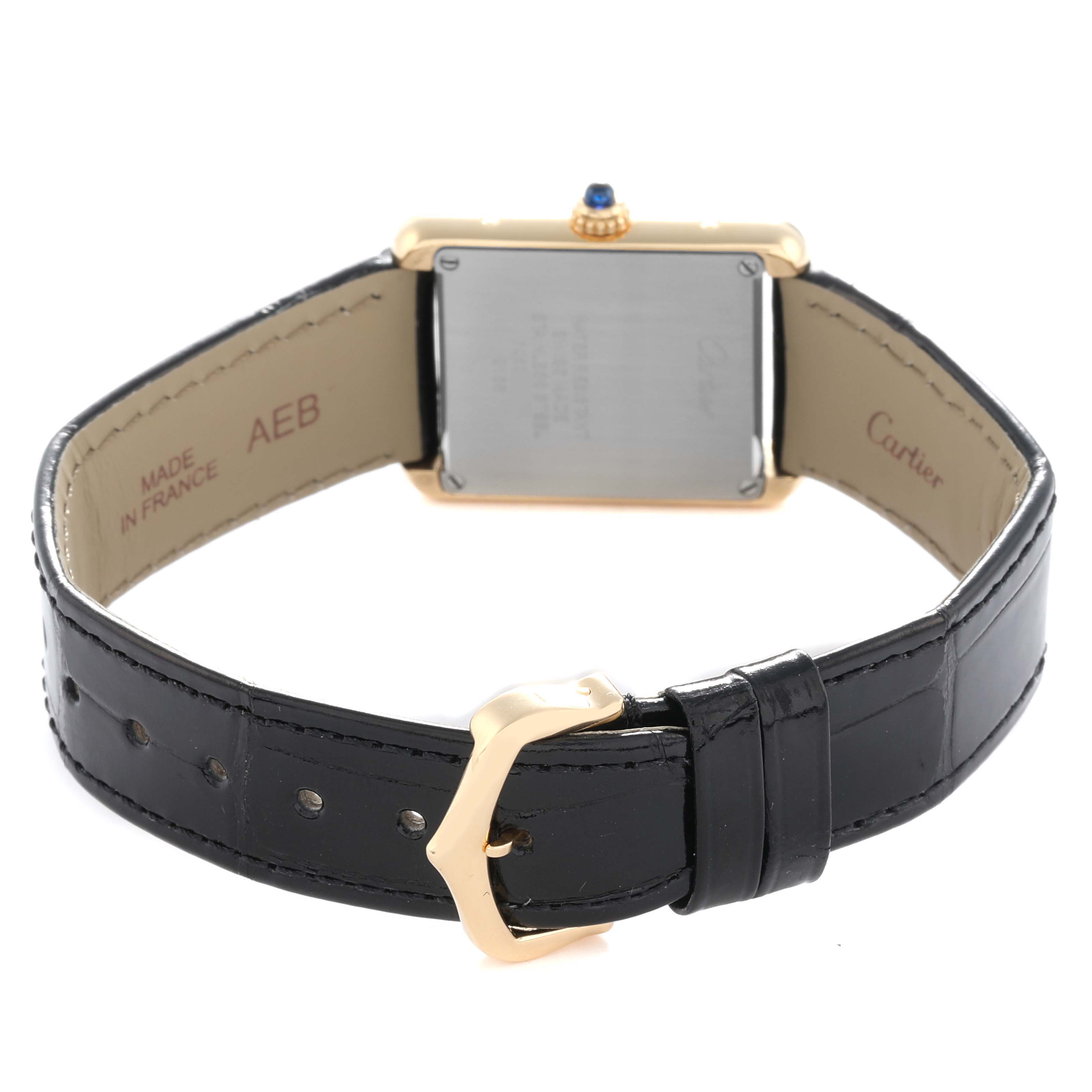 The image shows the back view of a Cartier Tank Solo W5200002 Women
s Steel and Gold (two tone) Silver Dial watch, highlighting the case, crown, strap, and clasp.