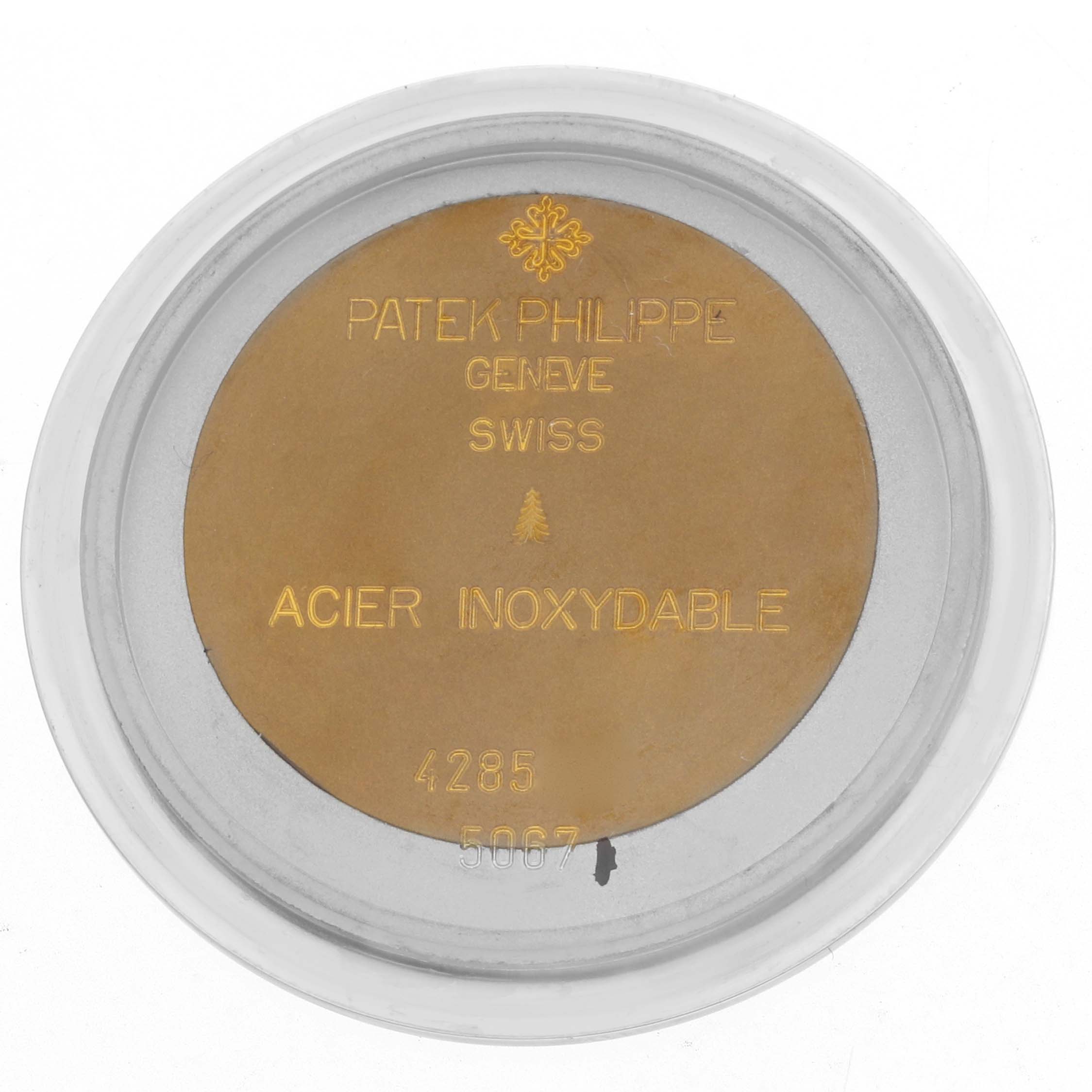 The image shows the packaging for a Patek Philippe Aquanaut 5067A-014 Women
s Stainless Steel Black Dial watch accessory, displaying brand inscriptions and model details.