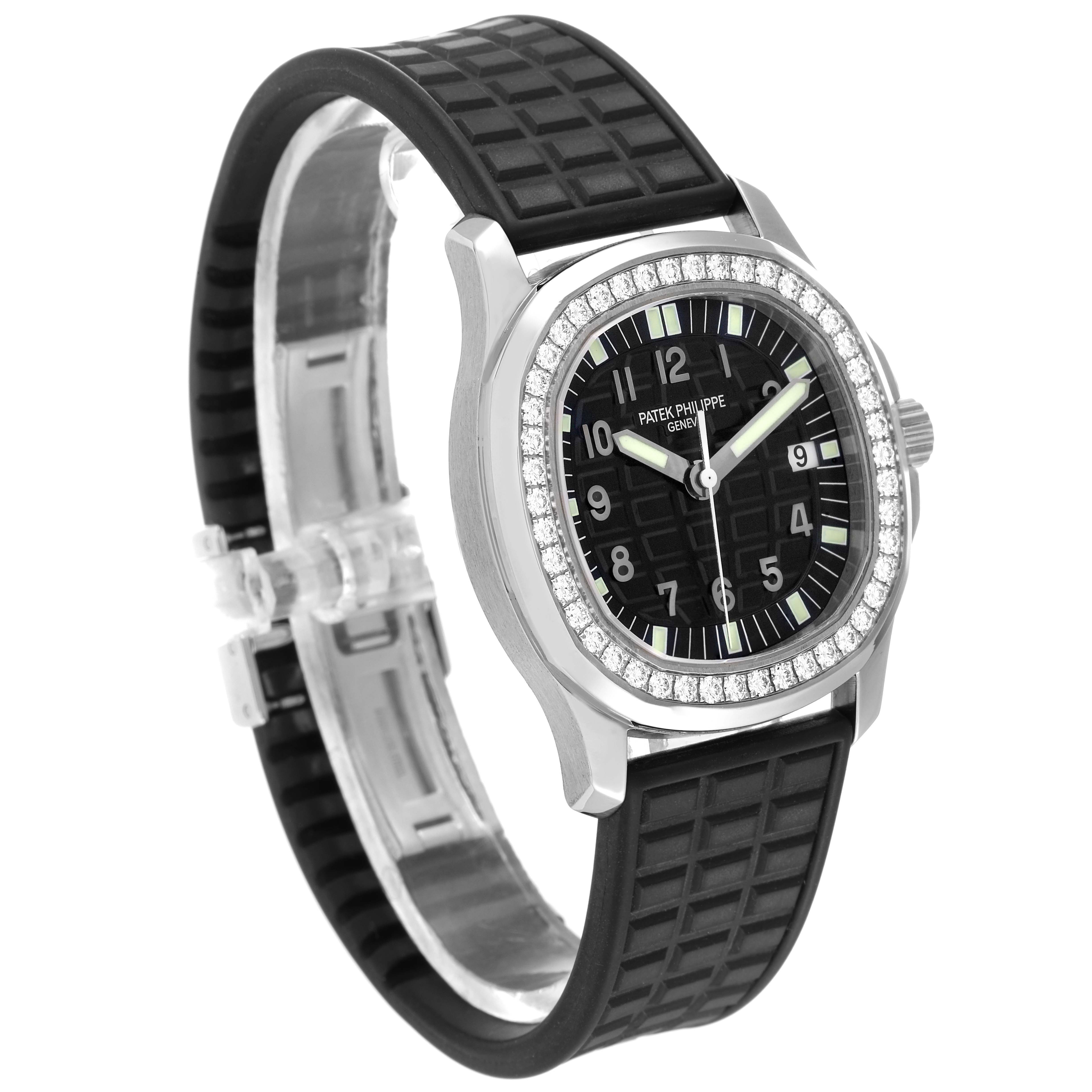 The Patek Philippe Aquanaut 5067A-014 Women
s Stainless Steel Black Dial watch is shown at a three-quarter angle, displaying its black rubber strap, diamond bezel, and face.