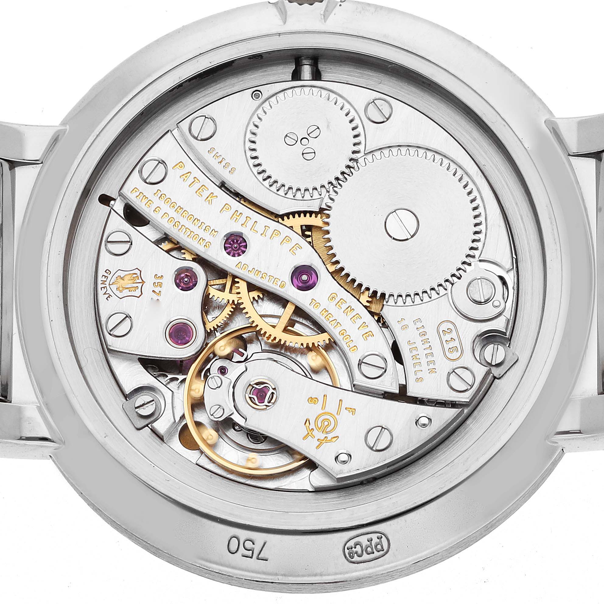 The image shows the back view of a Patek Philippe Calatrava 7119G Women
s White Gold White Dial watch, revealing its intricate mechanical movement.