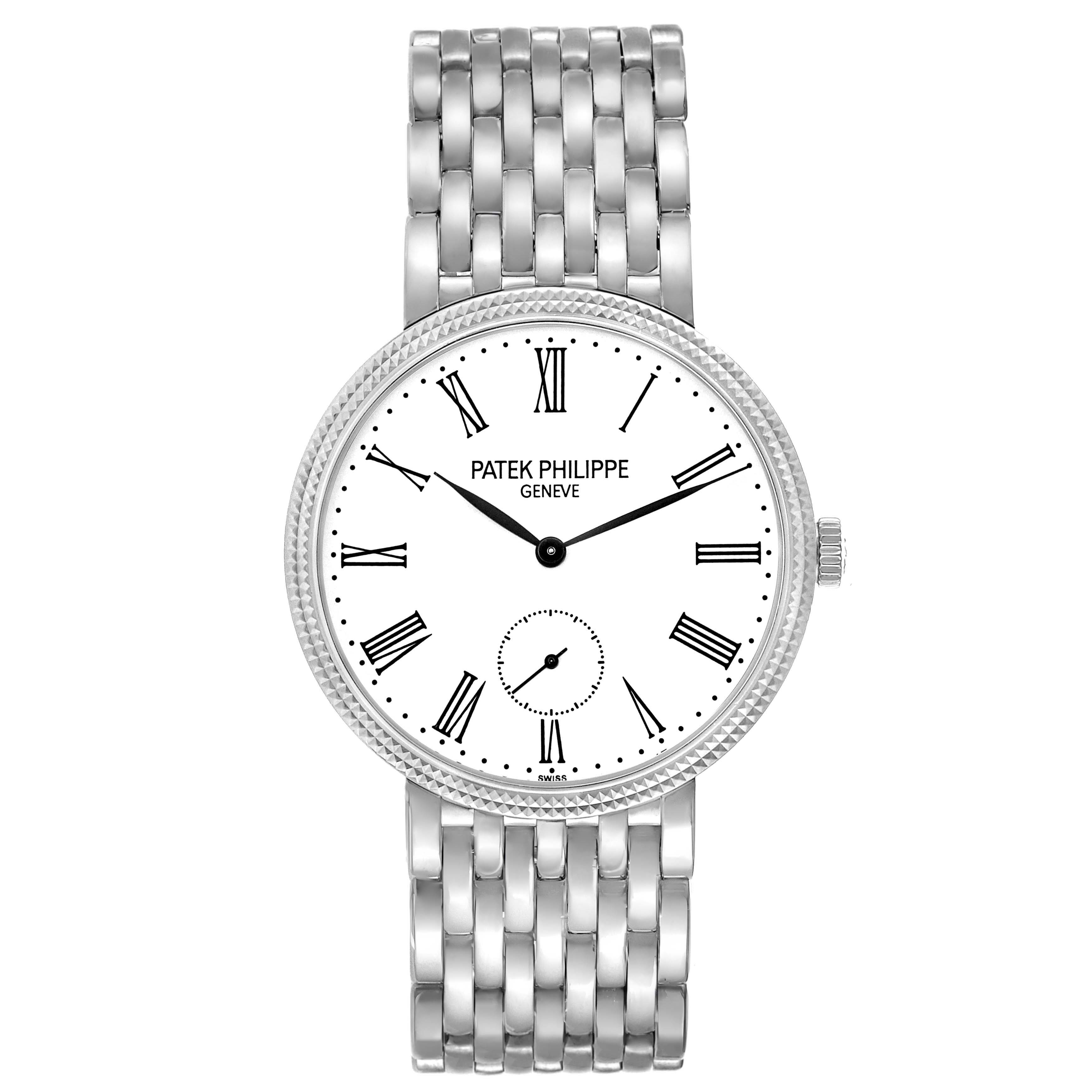 The Patek Philippe Calatrava 7119G Women
s White Gold White Dial watch is shown from a top-down angle, displaying the full face, Roman numerals, and bracelet.