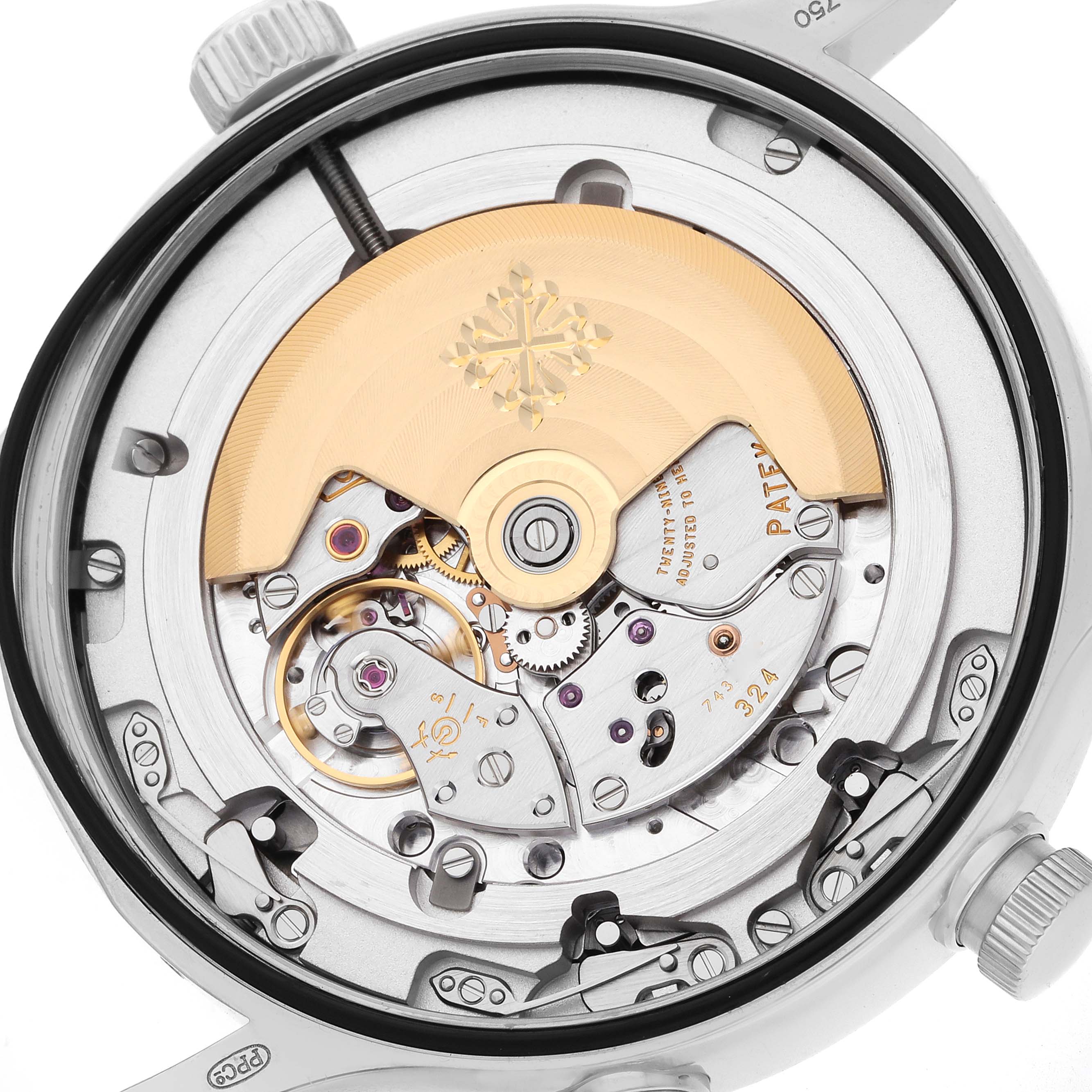 The image shows the back view of a Patek Philippe Calatrava 5524G Men
s White Gold Blue Dial, highlighting its intricate mechanical movement and rotor.