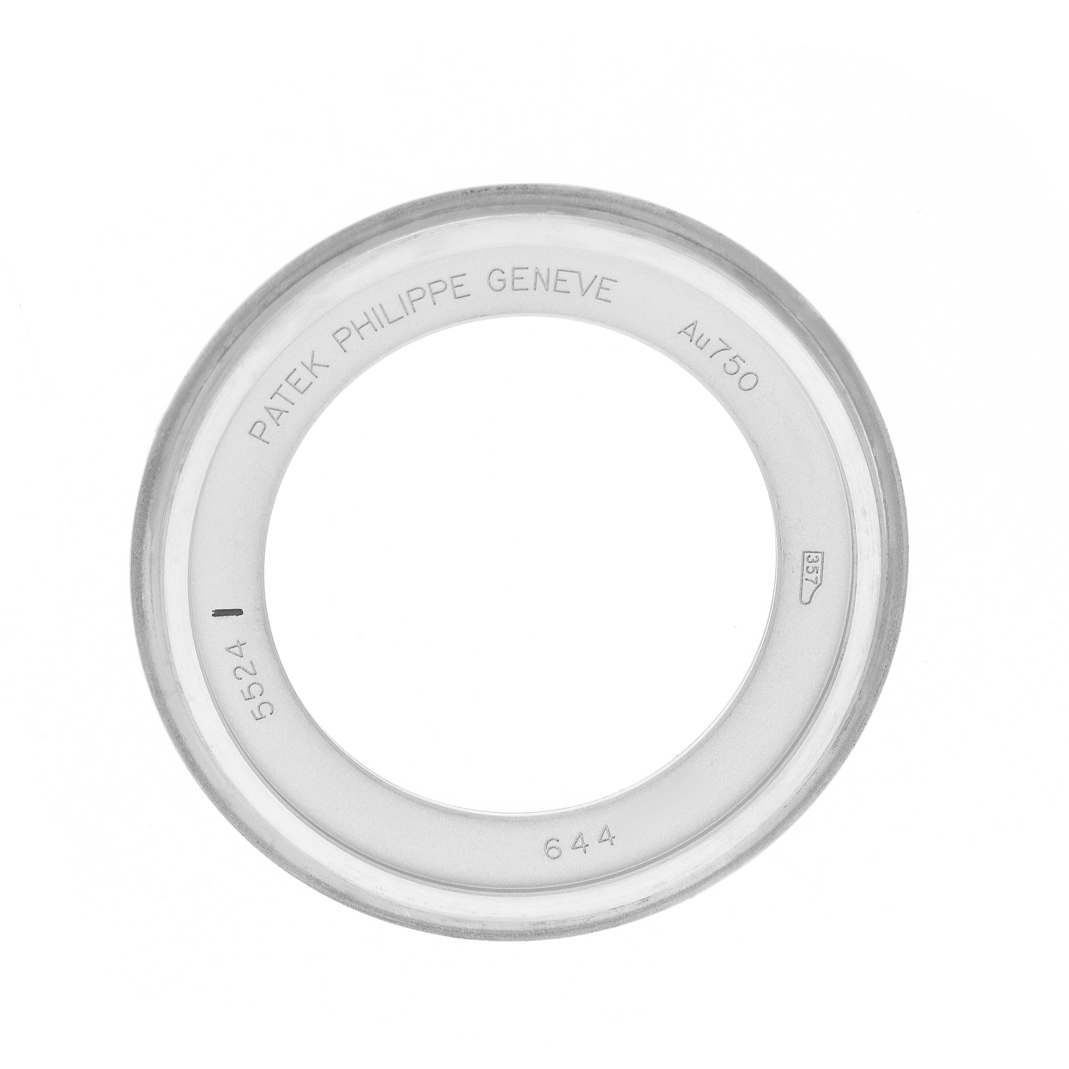 The image shows a top view of a bezel for a Patek Philippe Calatrava 5524G Men
s White Gold Blue Dial watch, displaying branding and material marks.