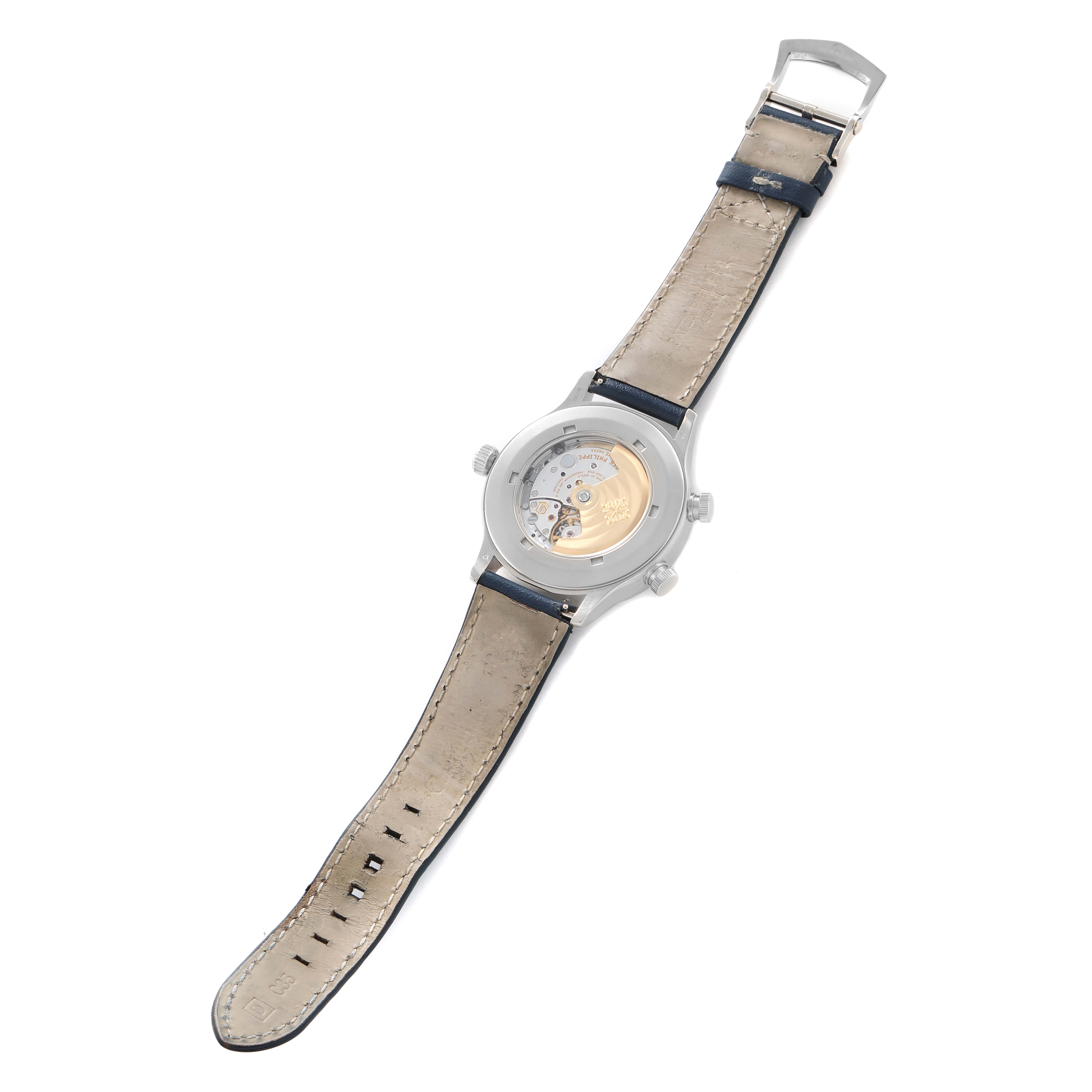 The image shows the back of the Patek Philippe Calatrava 5524G Men
s White Gold Blue Dial watch, highlighting the movement through the case back, strap extended flat.