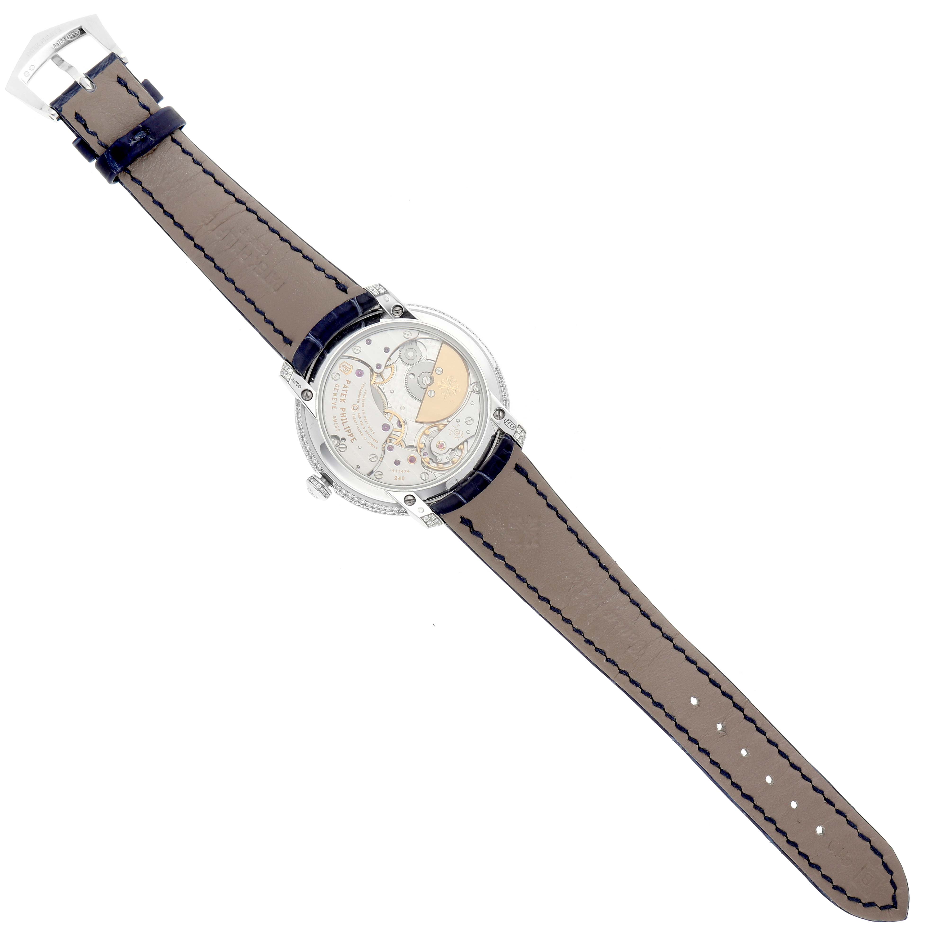 This image shows the back side and leather strap of a Patek Philippe Calatrava 4978 Women's White Gold Silver Dial 4978 Women's White Gold Silver Dial watch displayed flat with an open back view of the movement.