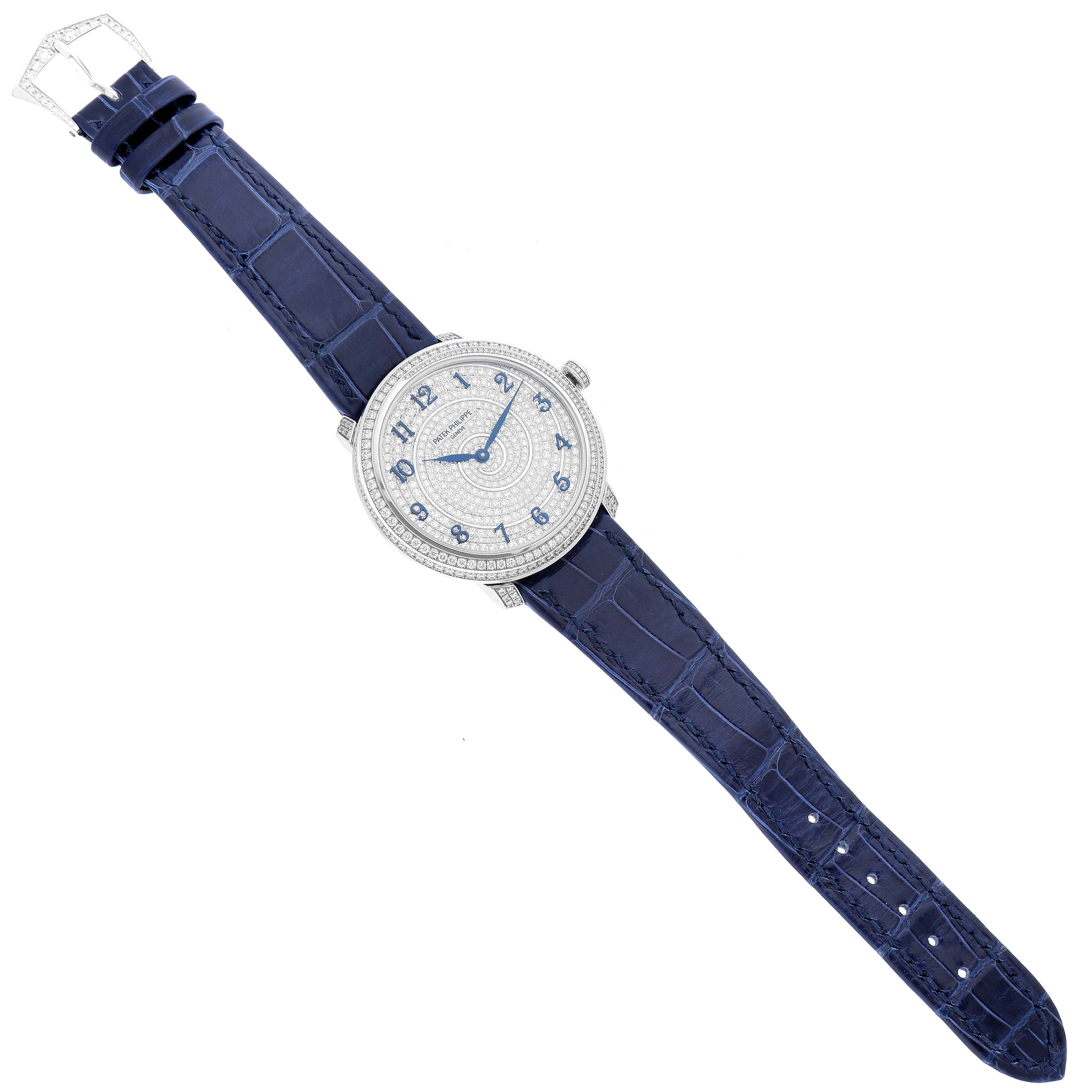The image shows a top-down view of a Patek Philippe Calatrava 4978 Women's White Gold Silver Dial 4978 Women's White Gold Silver Dial watch with a blue strap and a jeweled face.