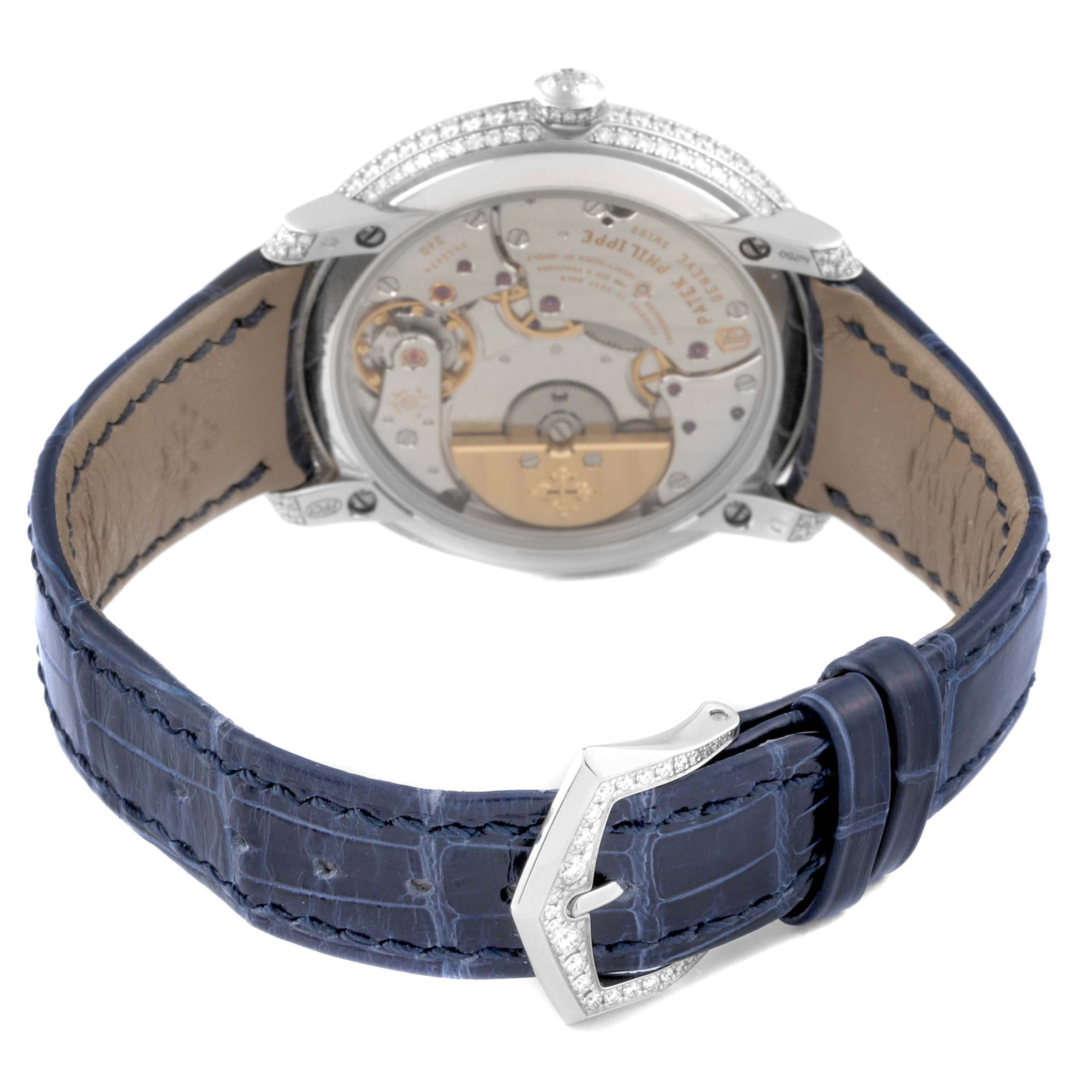 The image shows the back view of a Patek Philippe Calatrava 4978 Women's White Gold Silver Dial 4978 Women's White Gold Silver Dial, highlighting the movement and blue leather strap.