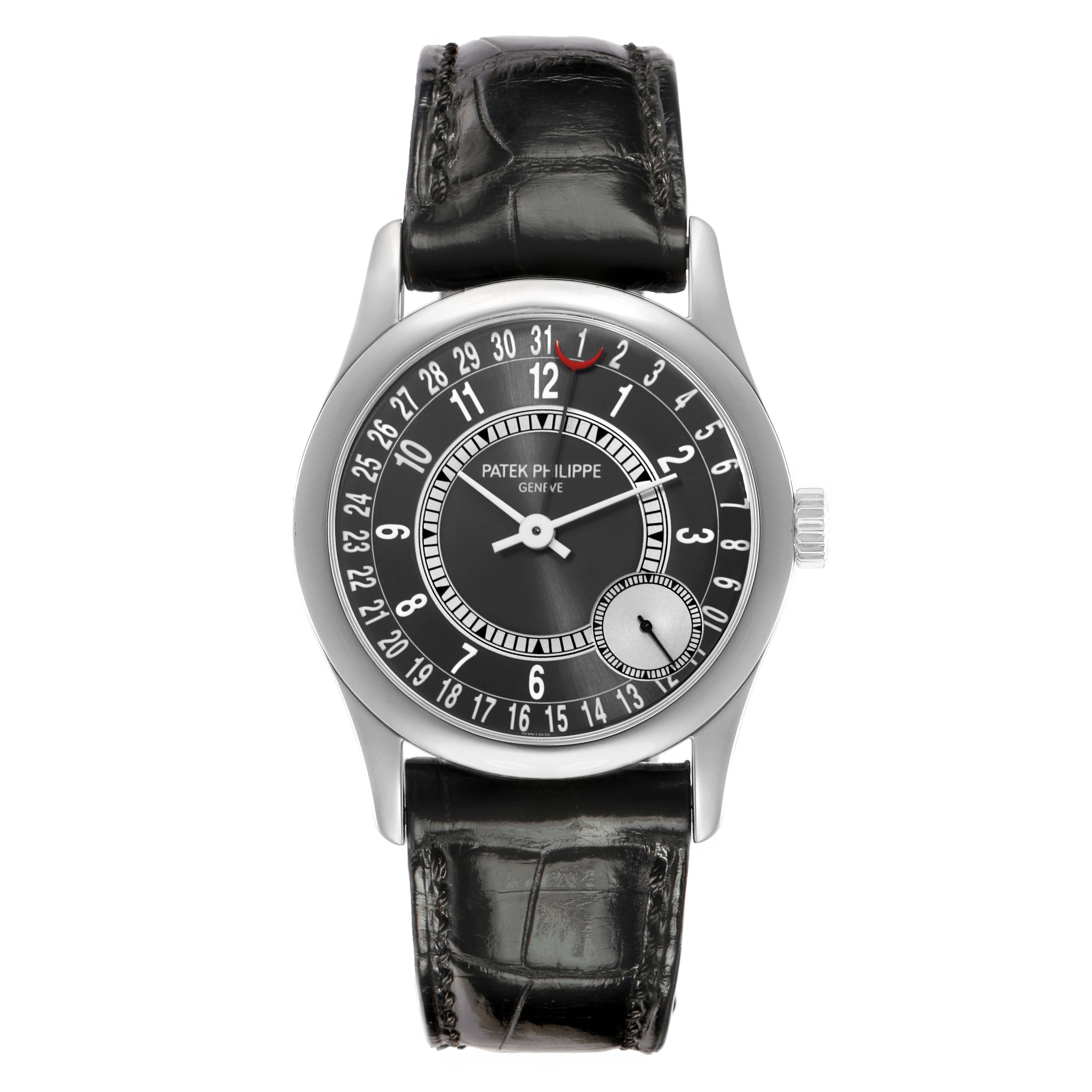 The Patek Philippe Calatrava 6000G-010 Men
s White Gold Black Dial watch is shown from a top-down angle, displaying its face, strap, and crown.