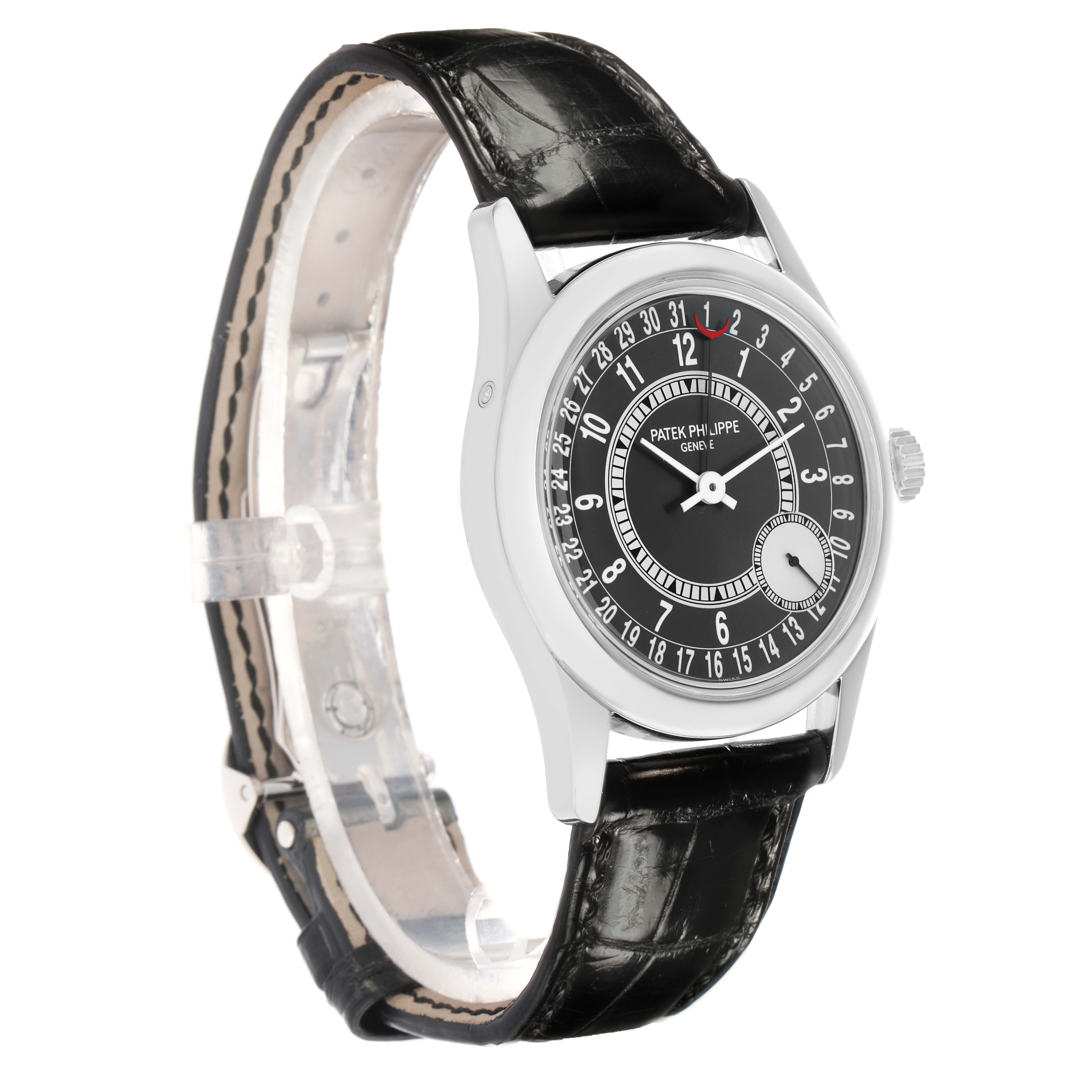 The Patek Philippe Calatrava 6000G-010 Men
s White Gold Black Dial watch is shown at a slight angle, highlighting the dial, case, crown, and leather strap.