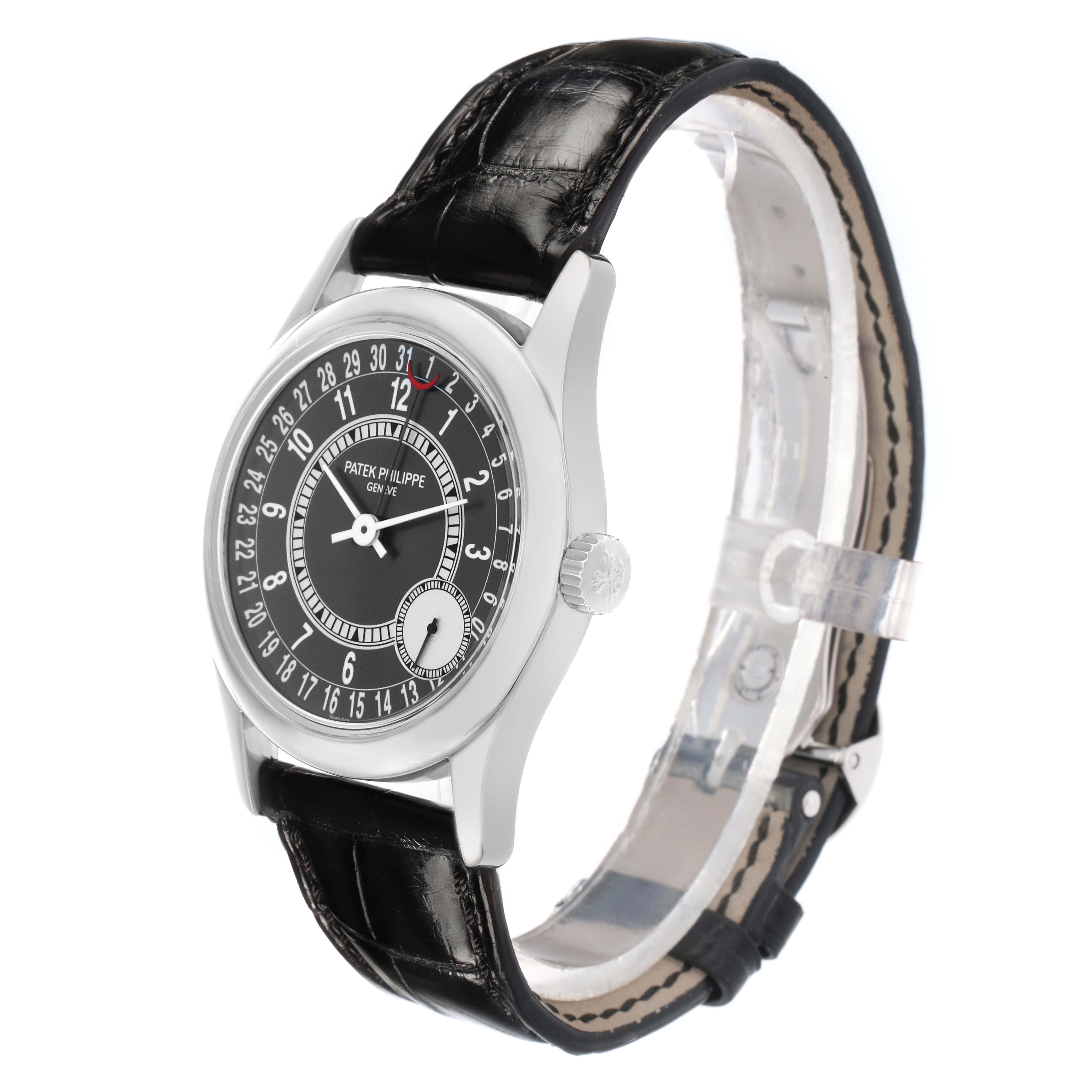 The Patek Philippe Calatrava 6000G-010 Men
s White Gold Black Dial watch is shown at a three-quarter angle, highlighting the dial, crown, and black leather strap.
