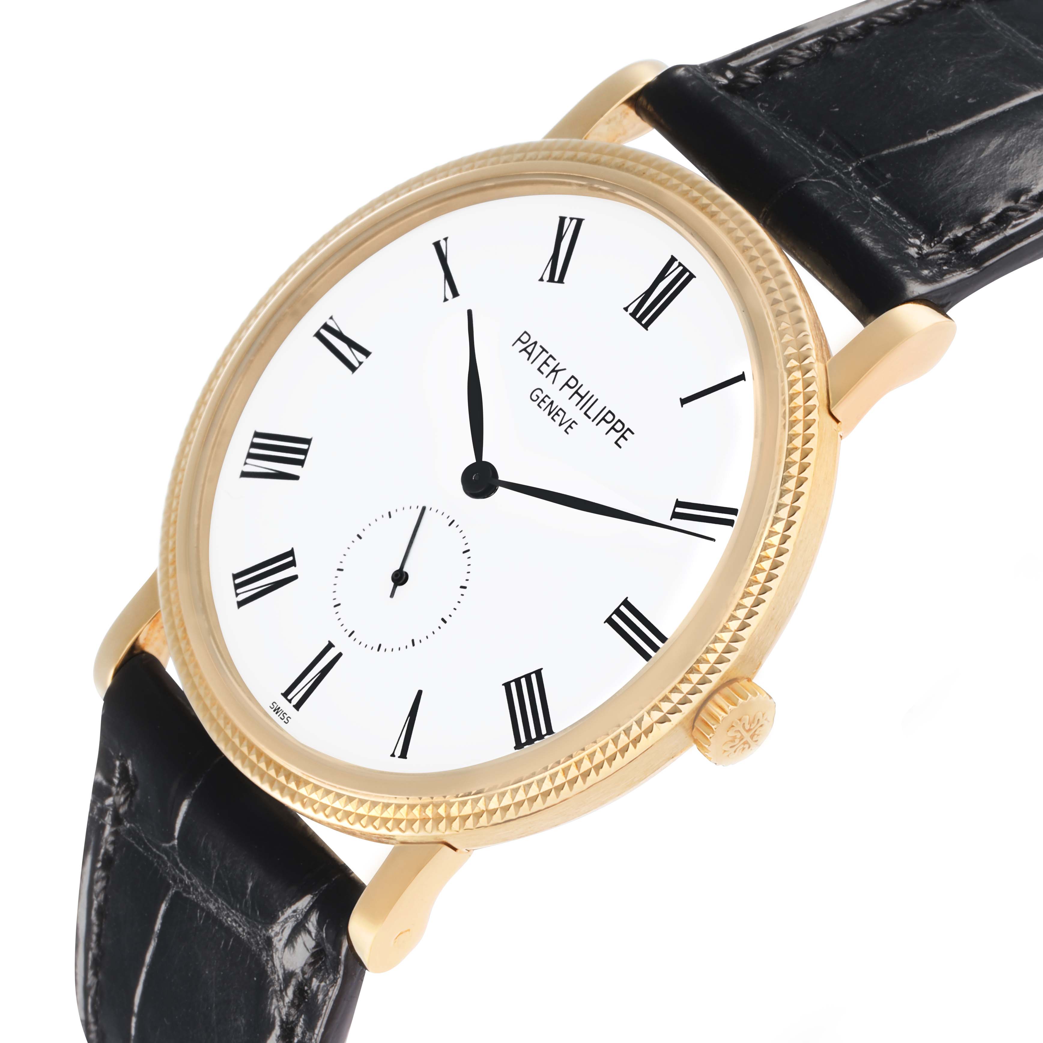The Patek Philippe Calatrava 5119J-001 Men
s Yellow Gold White Dial watch is shown at a slight angle, highlighting the dial, gold case, crown, and leather strap.
