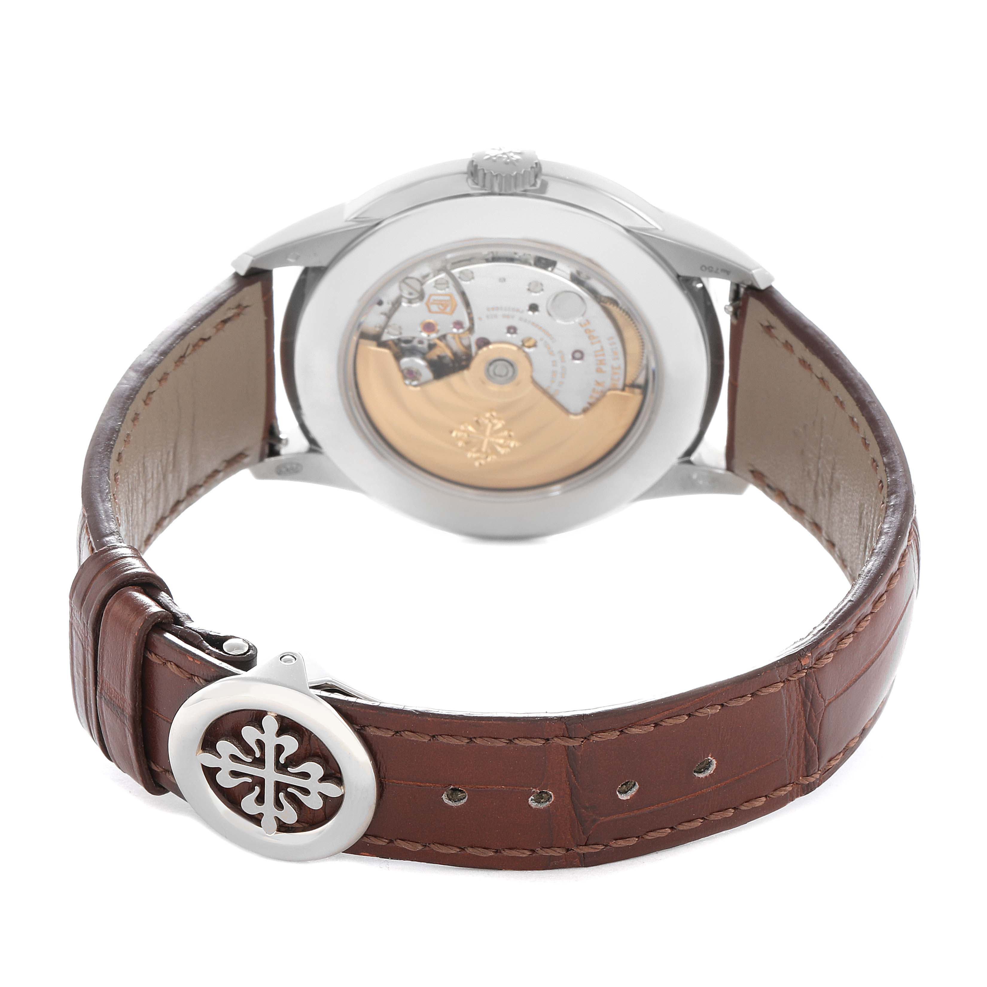 The Patek Philippe Complications 5320G Men
s White Gold Beige Dial model is shown from the back, highlighting the case back, leather strap, and clasp.