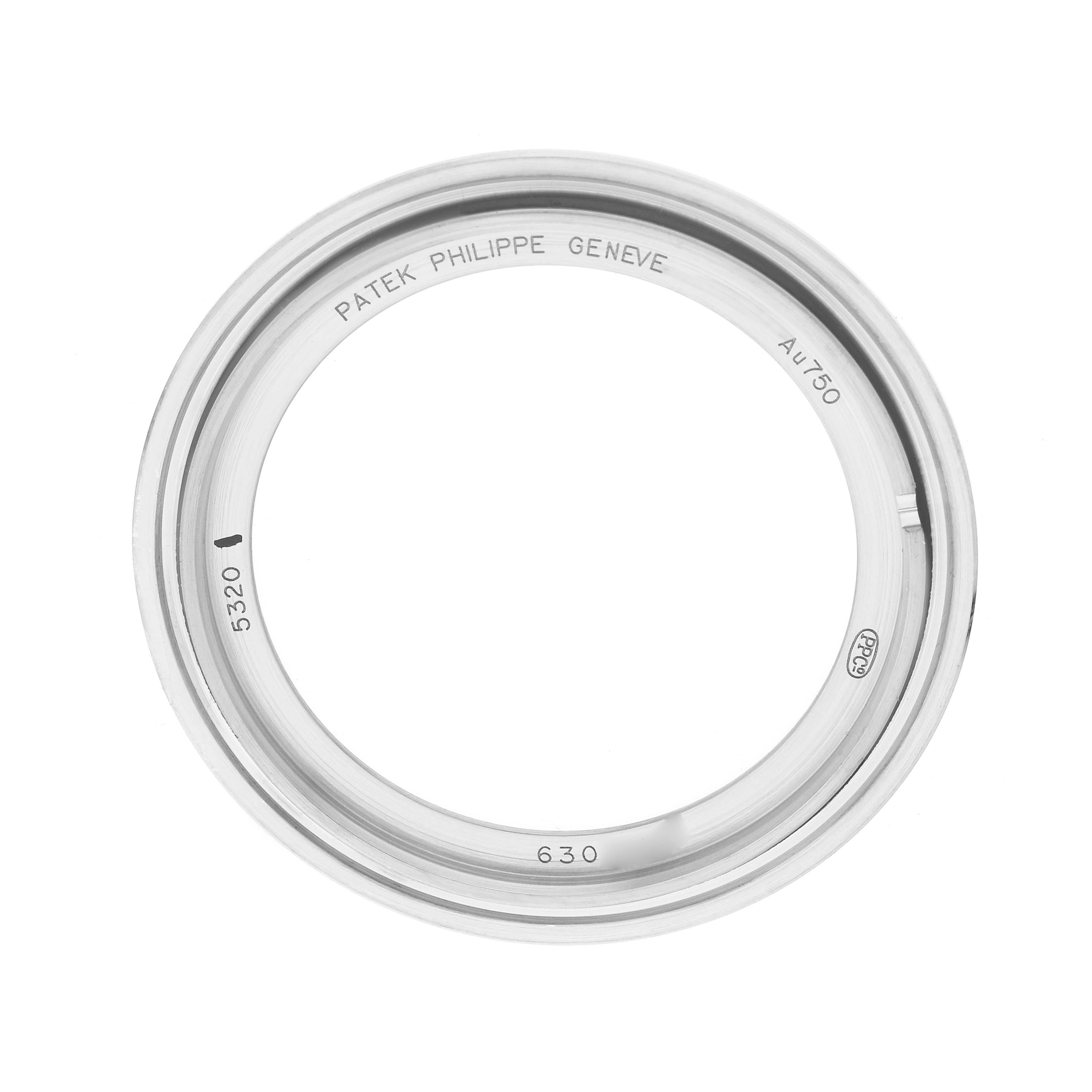 The image shows a top-view angle of a bezel for the Patek Philippe Complications 5320G Men
s White Gold Beige Dial model, highlighting engraved details.