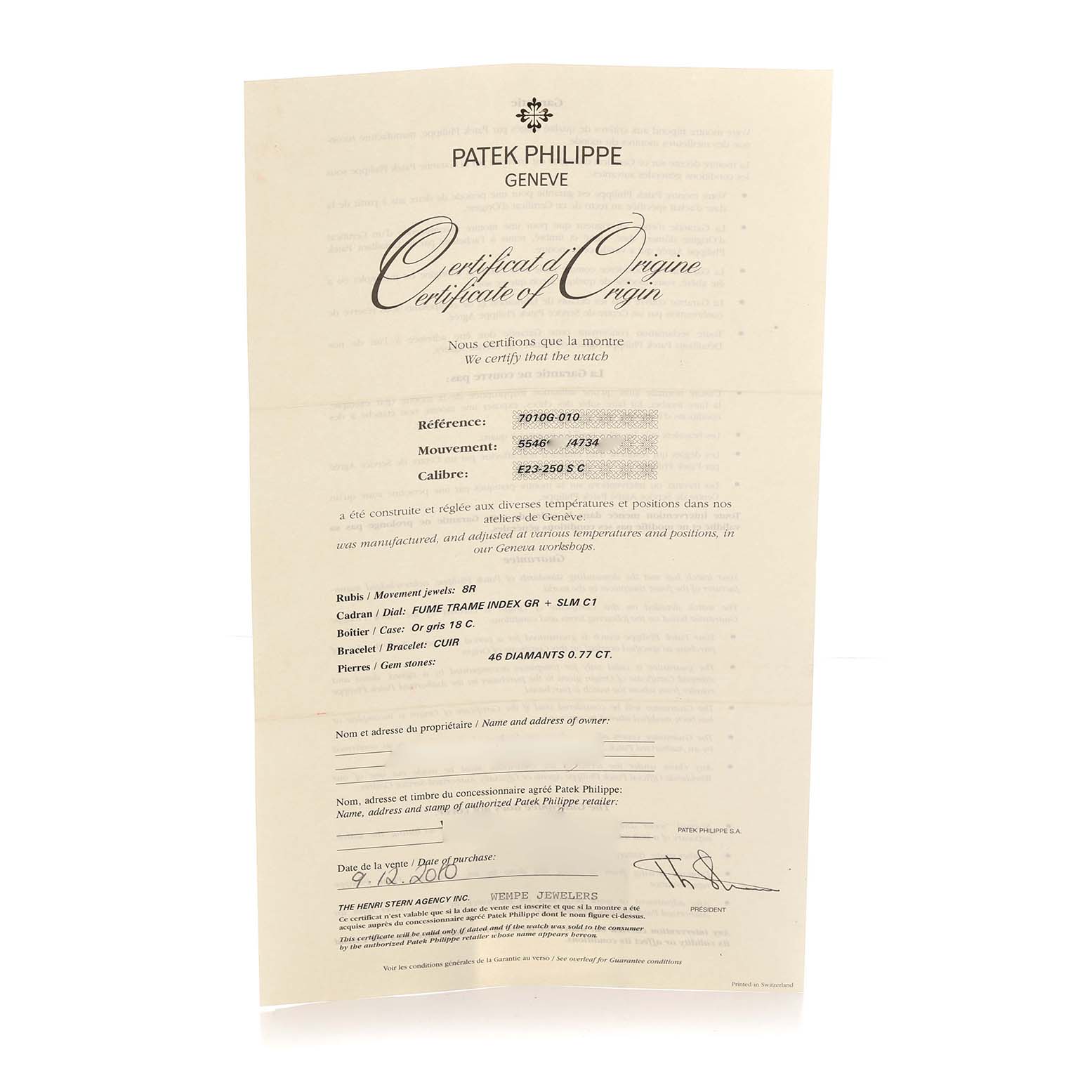 The image shows a Patek Philippe Nautilus 7010G-010 Women
s White Gold Silver Dial certificate from a straight-on angle, detailing reference and movement numbers.