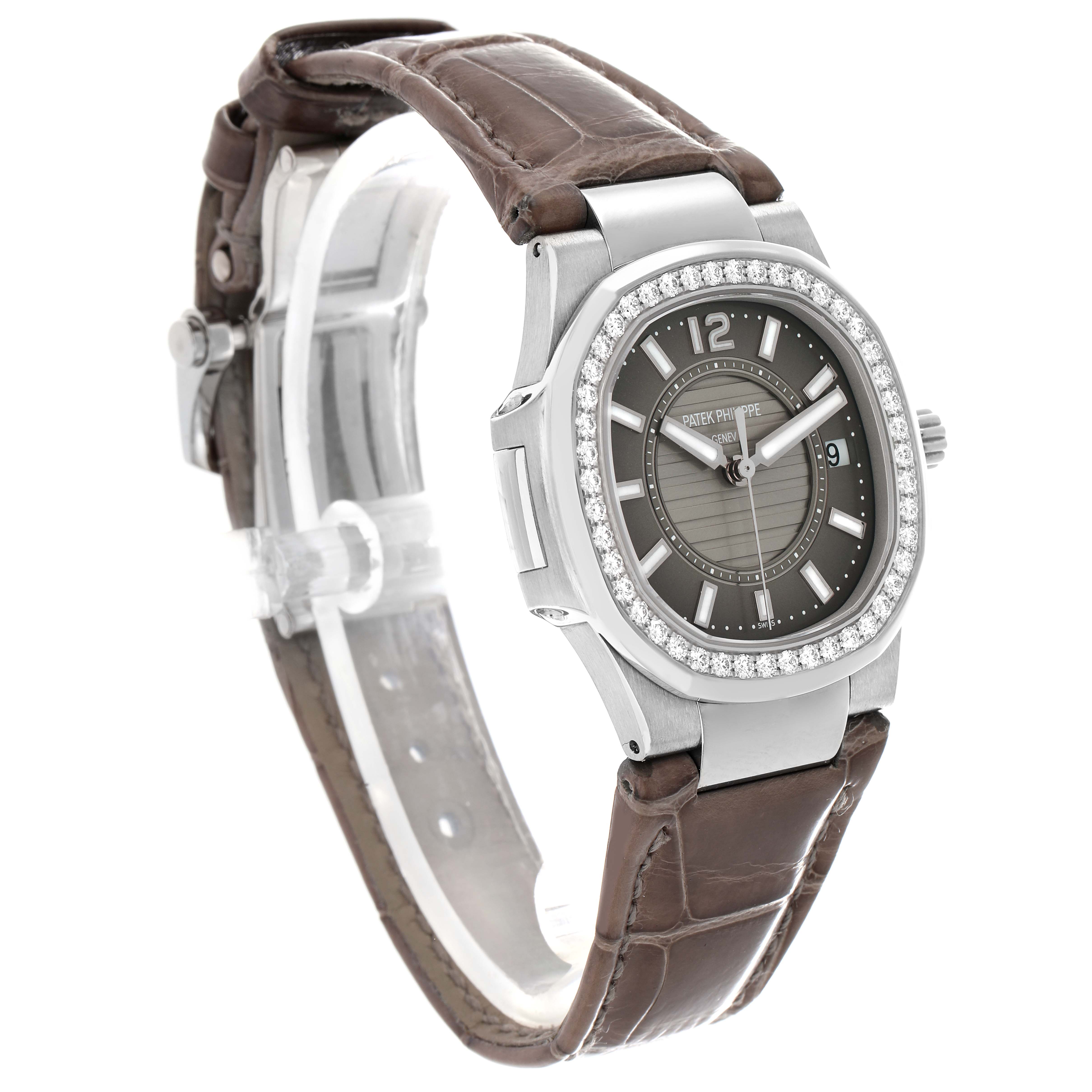 The Patek Philippe Nautilus 7010G-010 Women
s White Gold Silver Dial watch is shown at a three-quarter angle, highlighting the face, bezel, and part of the strap.