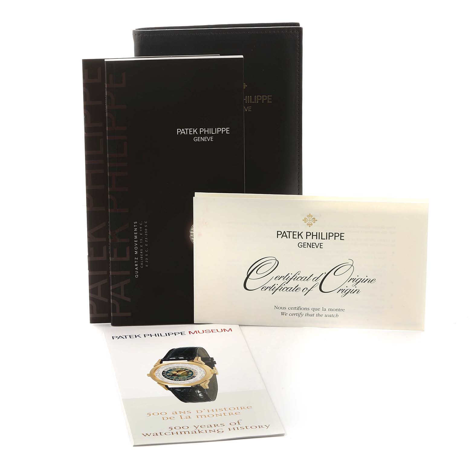 The image shows Patek Philippe Nautilus 7010G-010 Women
s White Gold Silver Dial accessories including a certificate, booklet, and museum pamphlet.