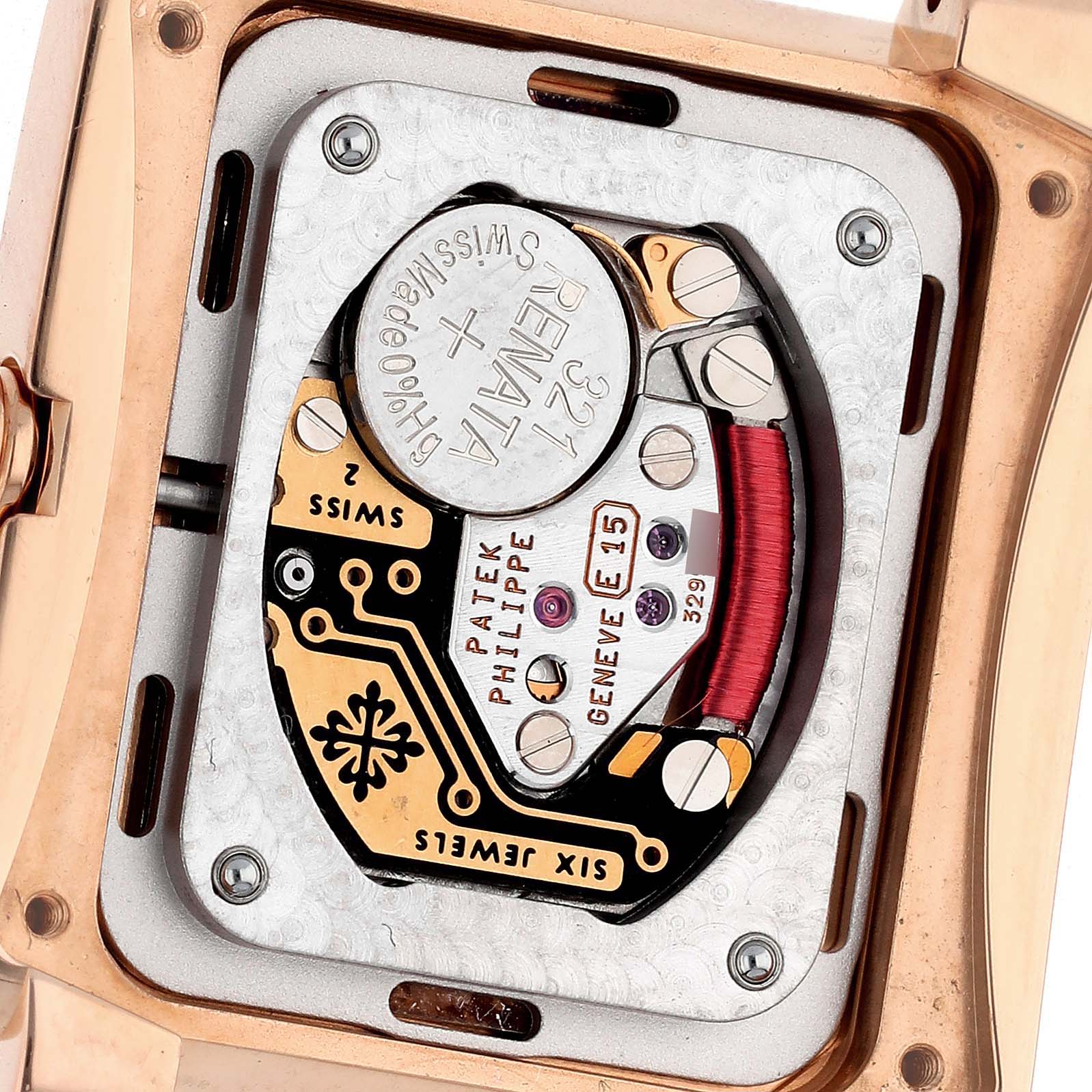 The image shows the back of the Patek Philippe Twenty-4 4910/11R-011 Women's Rose Gold Silver Dial 4910/11R-011 Women's Rose Gold Silver Dial watch, revealing its internal movement and battery.
