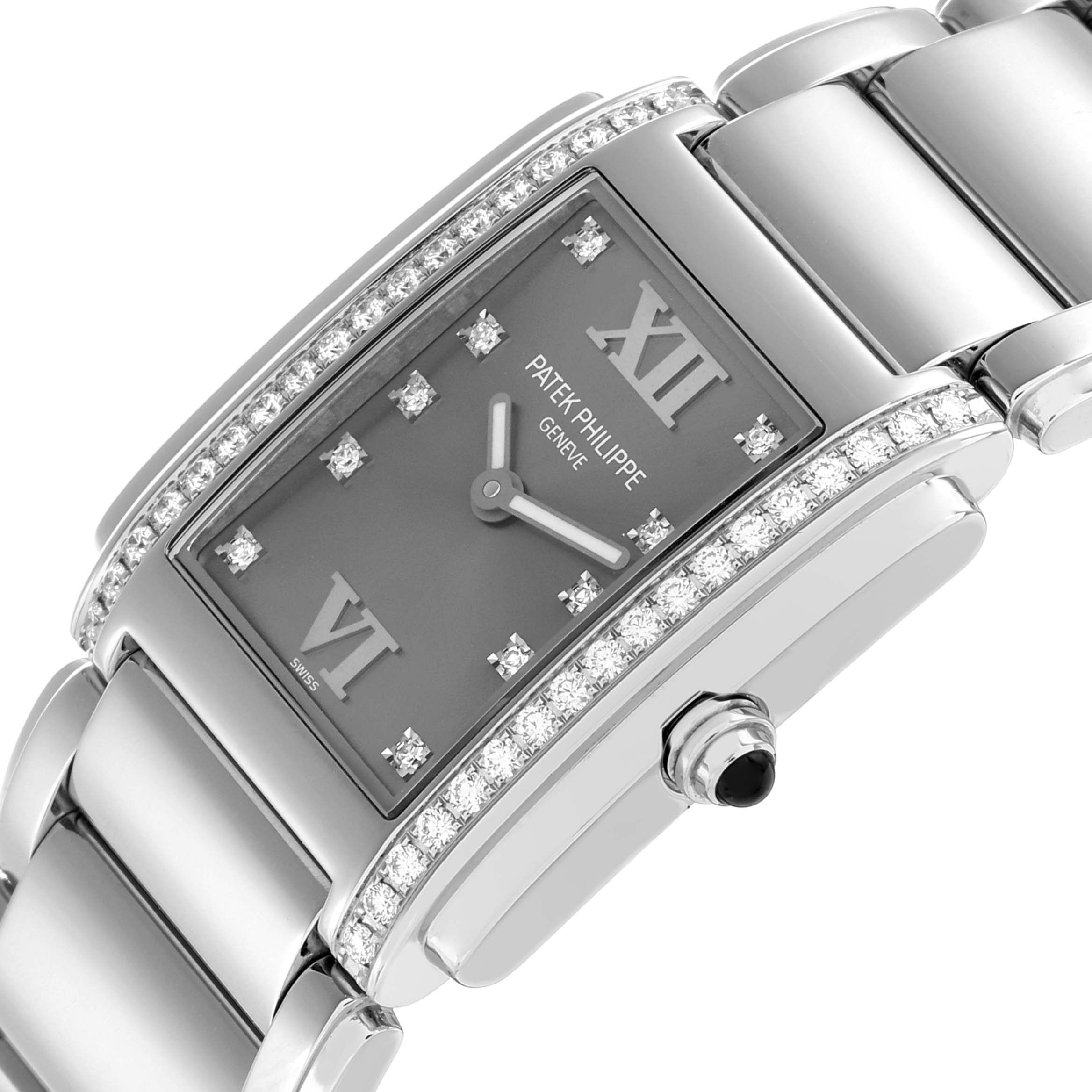 The Patek Philippe Twenty-4 4910/10A-010 Women
s Stainless Steel Silver Dial watch is shown at an angled close-up, highlighting its diamond-studded bezel and bracelet.