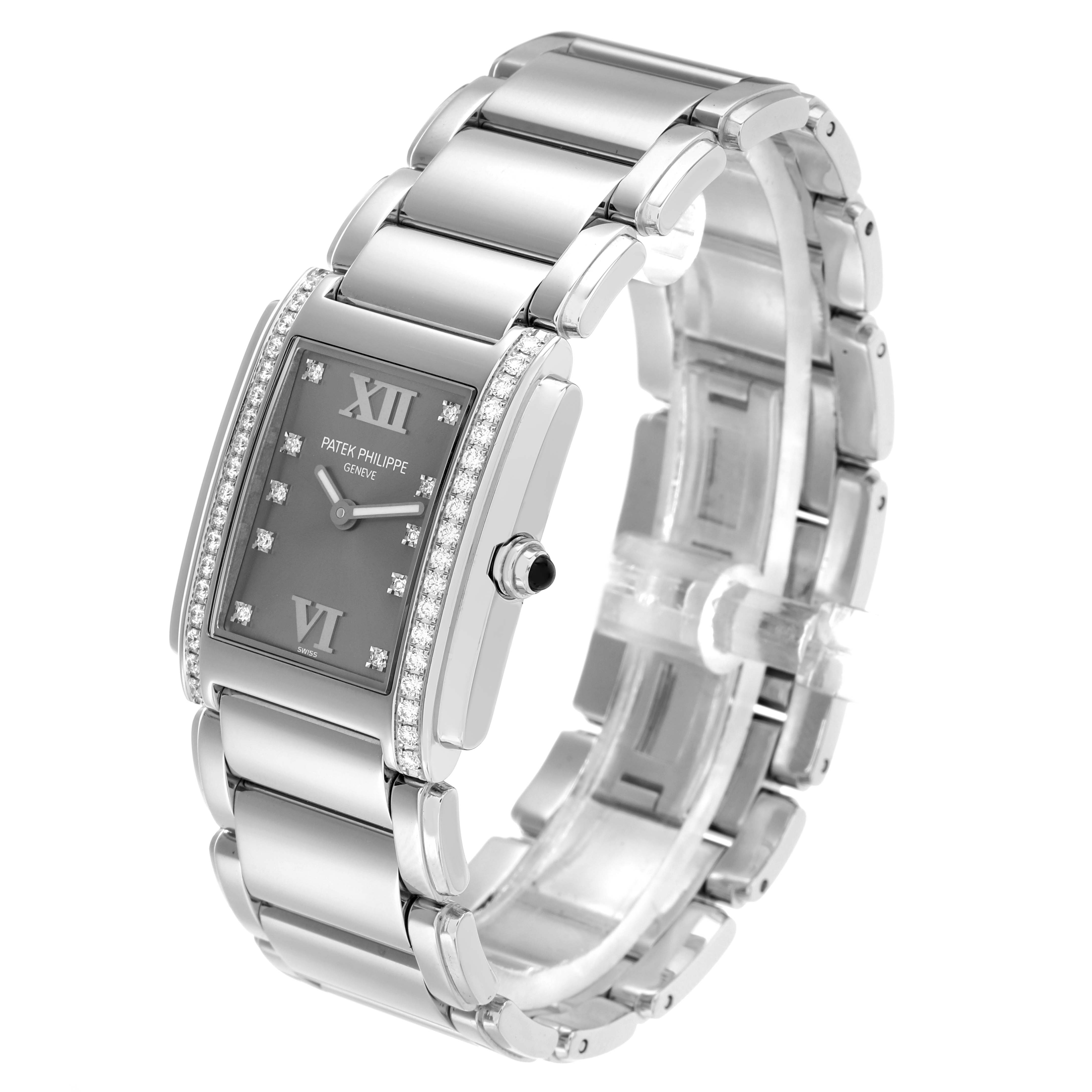 The Patek Philippe Twenty-4 4910/10A-010 Women
s Stainless Steel Silver Dial watch is shown at a three-quarter angle, showcasing the face, bracelet, side profile, and crown.