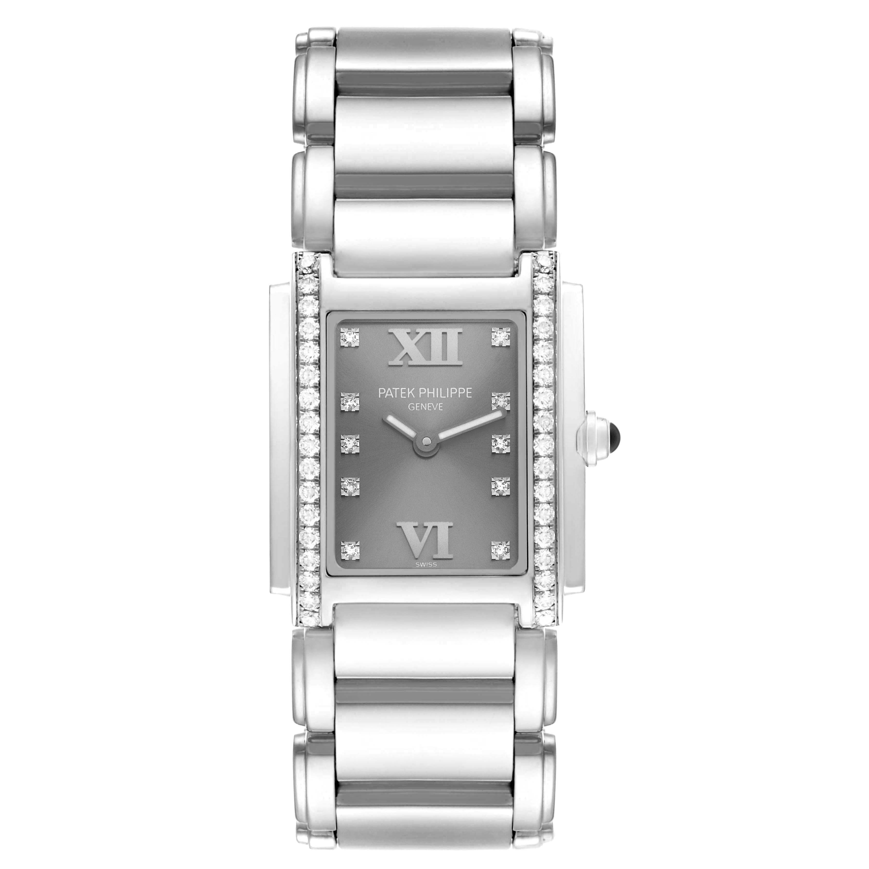 The Patek Philippe Twenty-4 4910/10A-010 Women
s Stainless Steel Silver Dial watch is shown from a top-down angle, featuring its dial, diamond bezel, and metal bracelet.