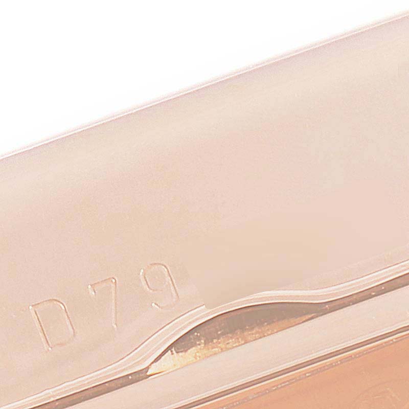 This image shows a close-up of the casing or clasp of a Rolex Cellini 5442 Men
s Rose Gold Black Dial 5442 Men
s Rose Gold Black Dial watch, displaying the engraved marking "D79."