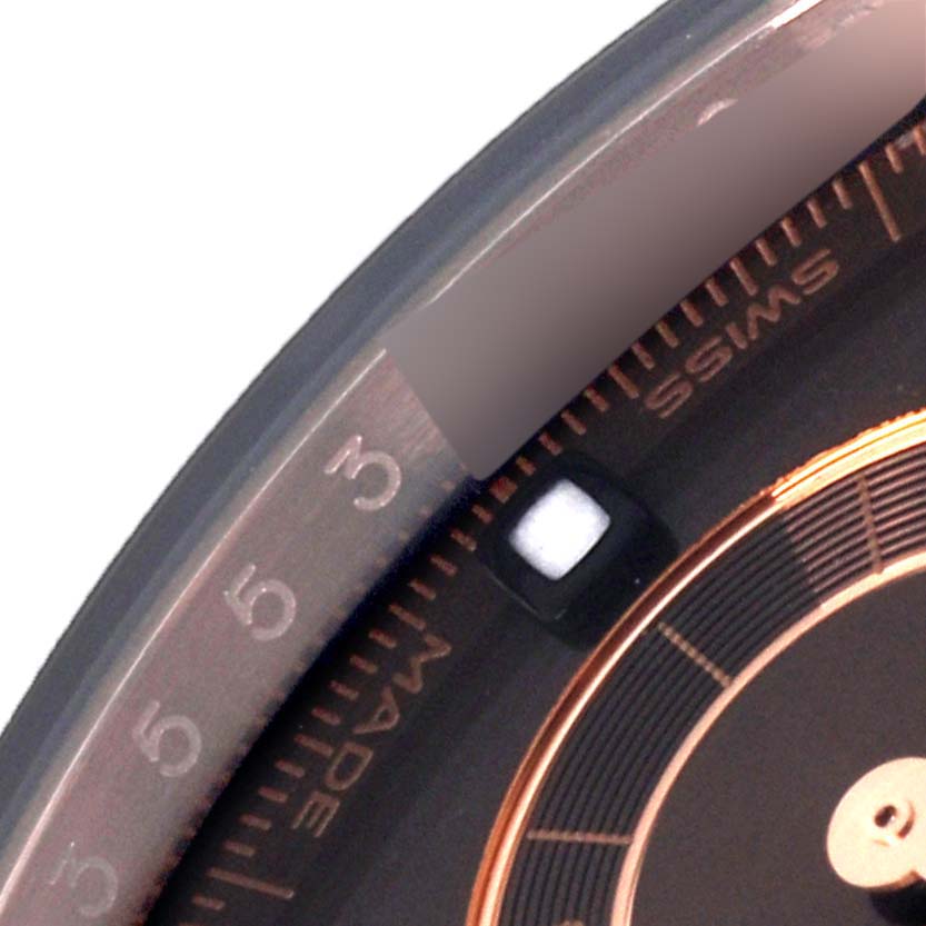 The image shows a close-up of the bezel and part of the dial of a Rolex Daytona 116515LN Men's Rose Gold Brown Dial 116515LN Men's Rose Gold Brown Dial watch.